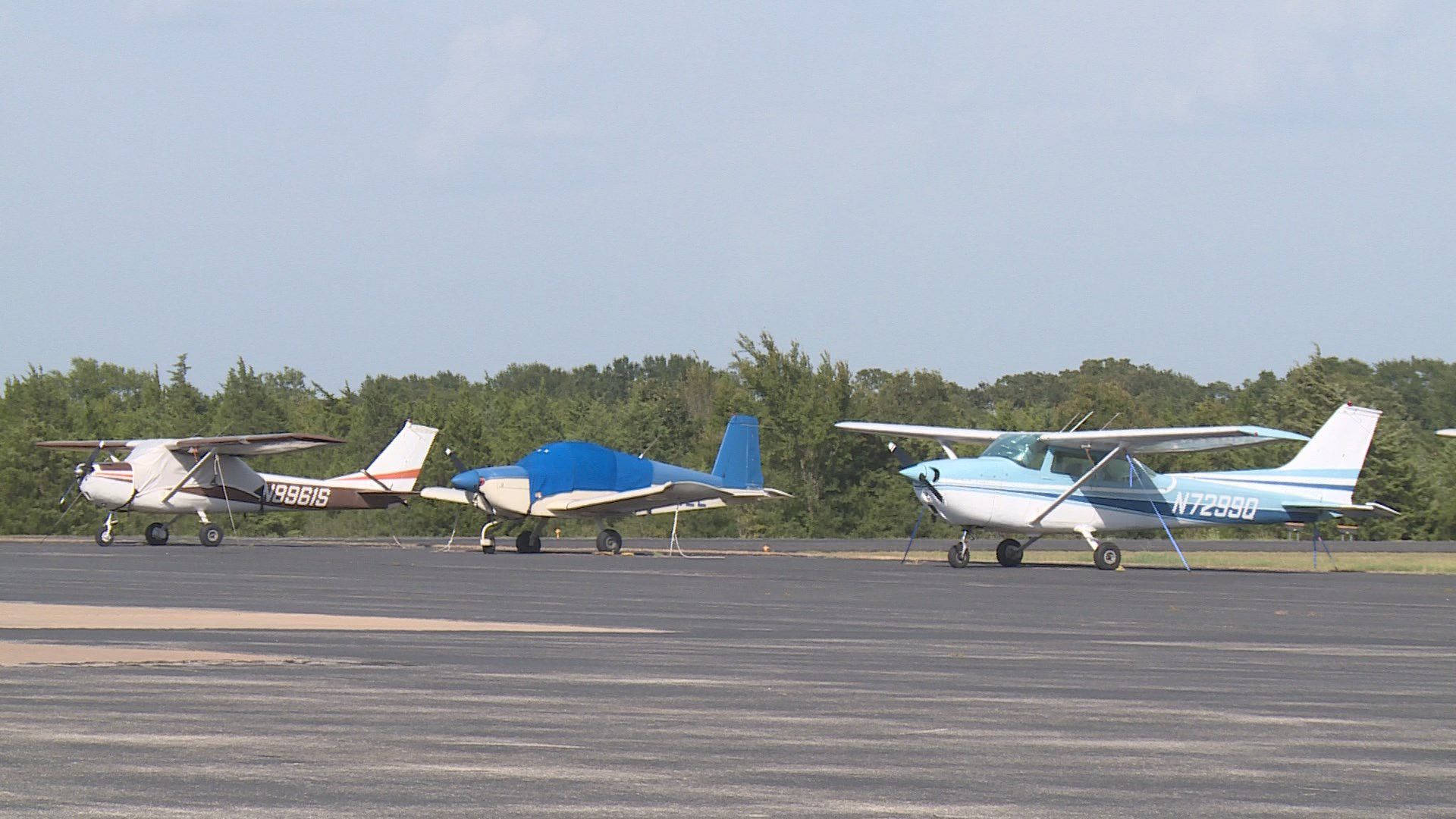 Small Planes At Airport Parking Wallpaper