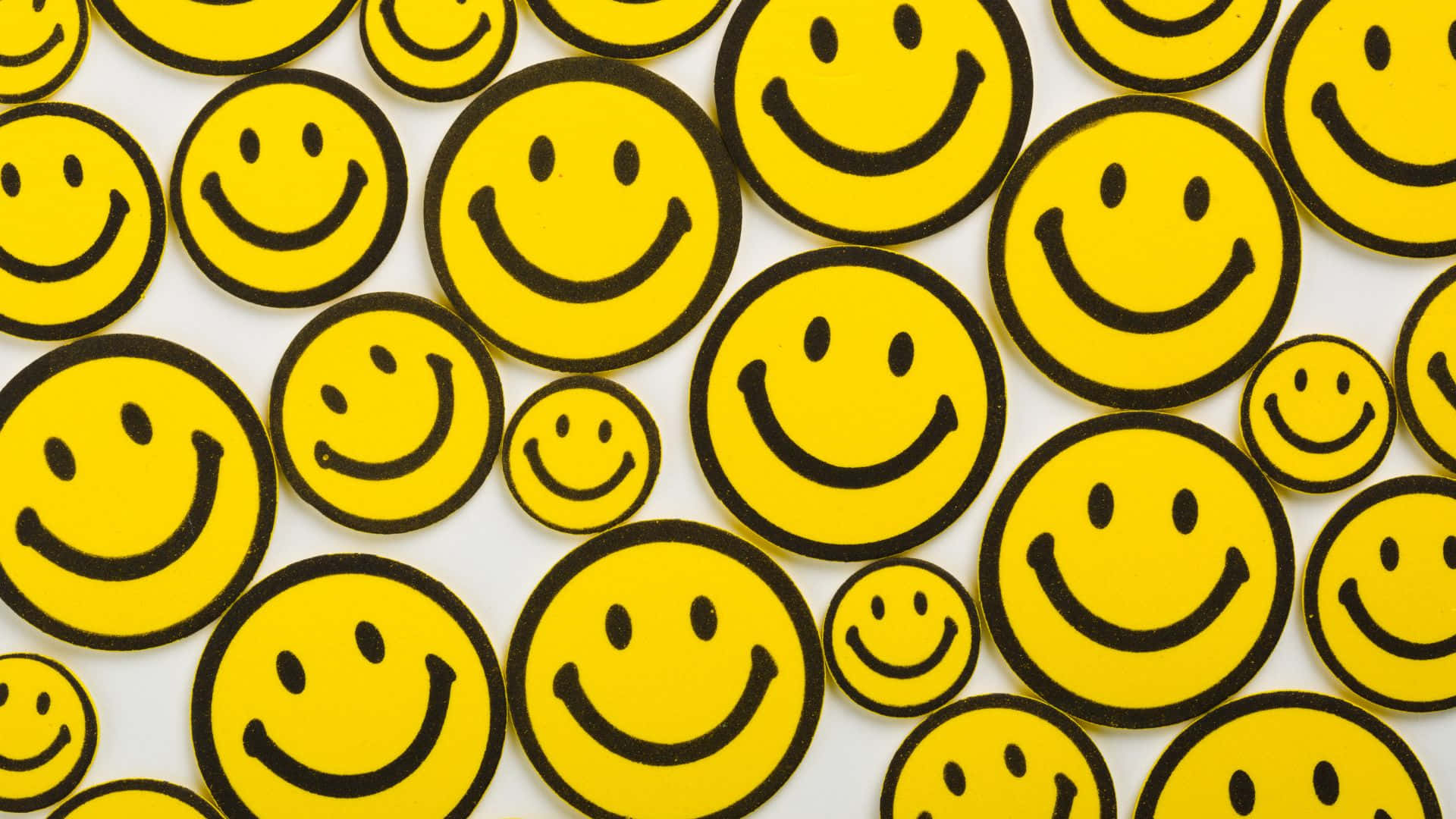 Gleeful Yellow Smiley Faces on Blue Background