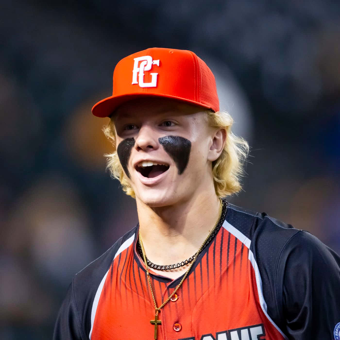 Smiling Baseball Player Red Cap Wallpaper