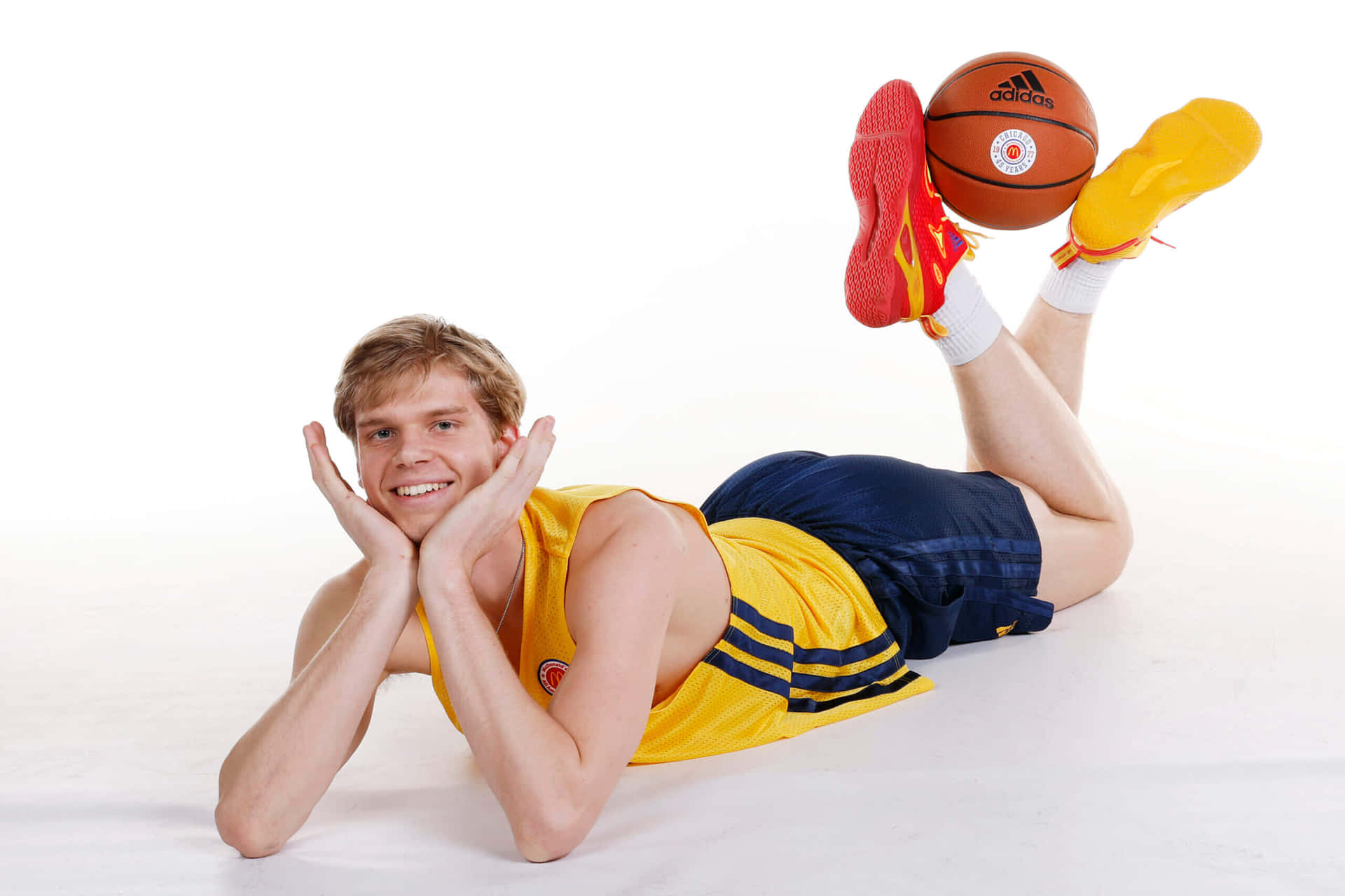 Smiling Basketball Player Lying Down Wallpaper