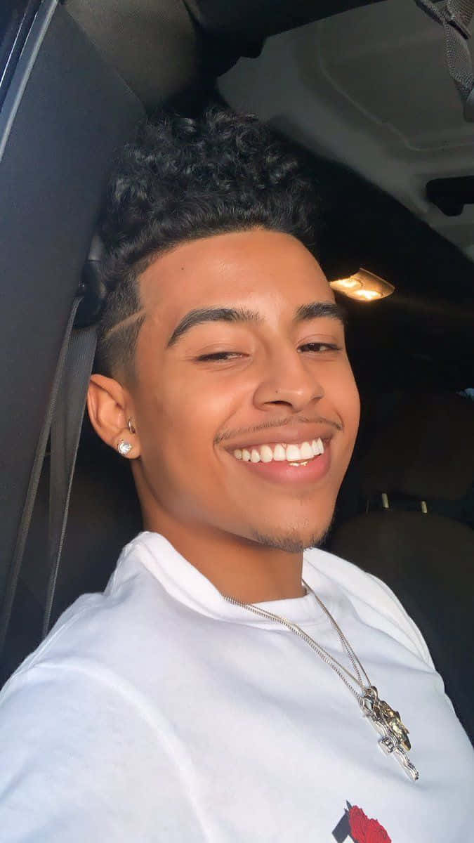 Smiling Boyin Car Selfie Wallpaper