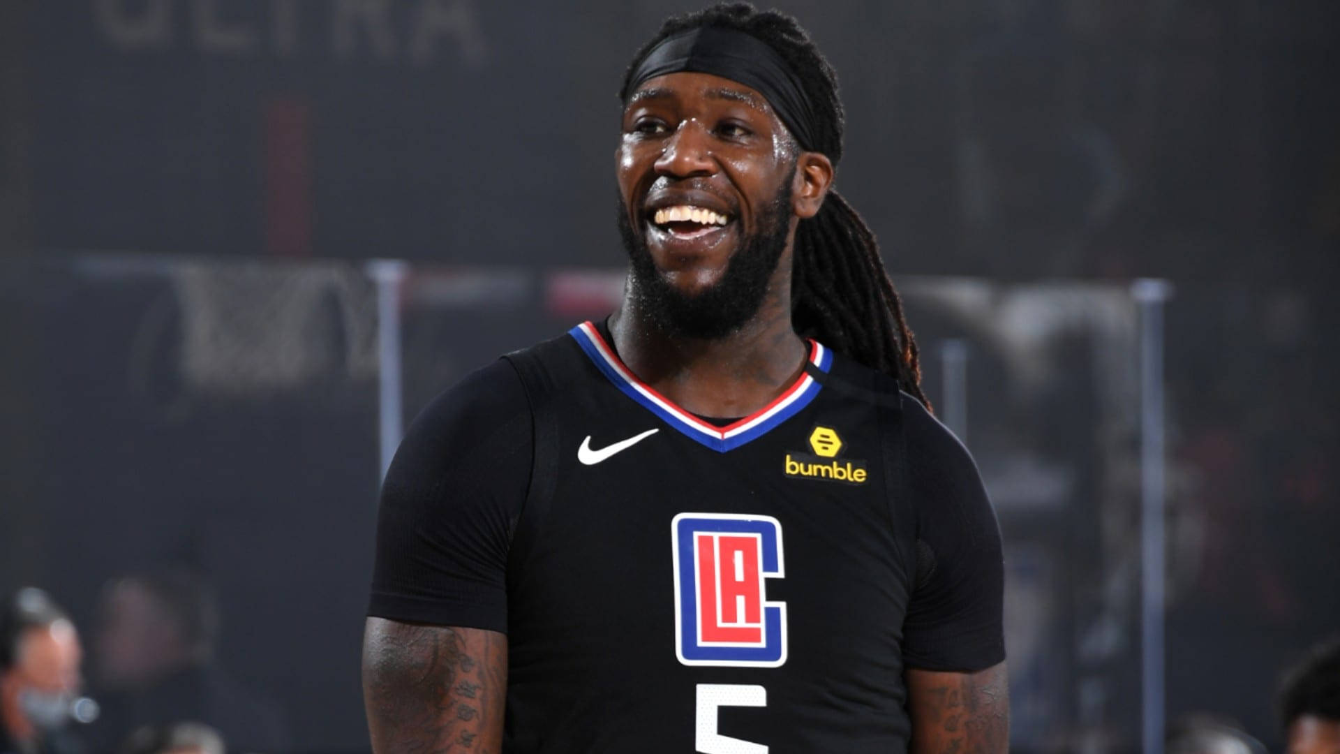 Smiling Montrezl Harrell, player of the Clippers, during a game Wallpaper
