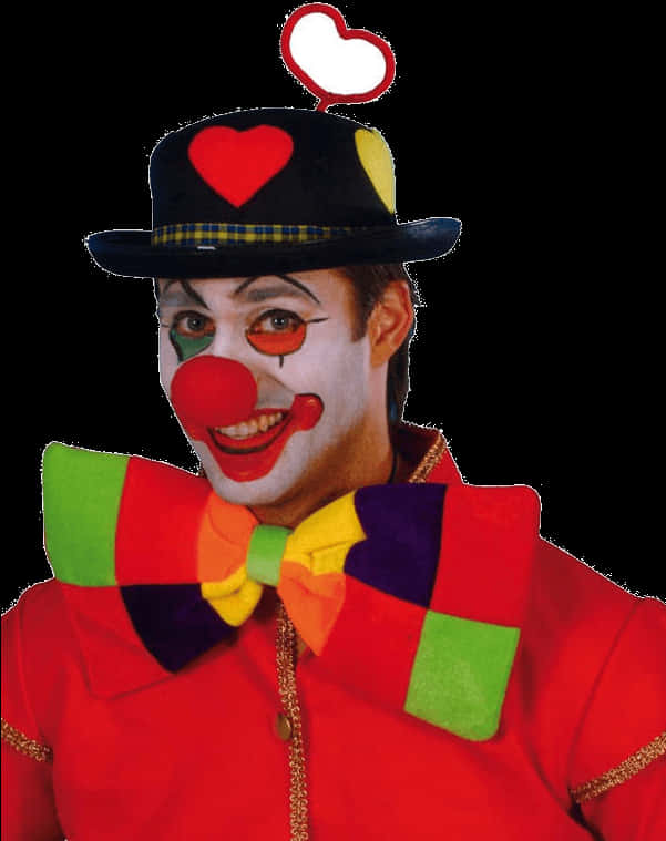 Smiling Clownwith Red Noseand Colorful Attire PNG