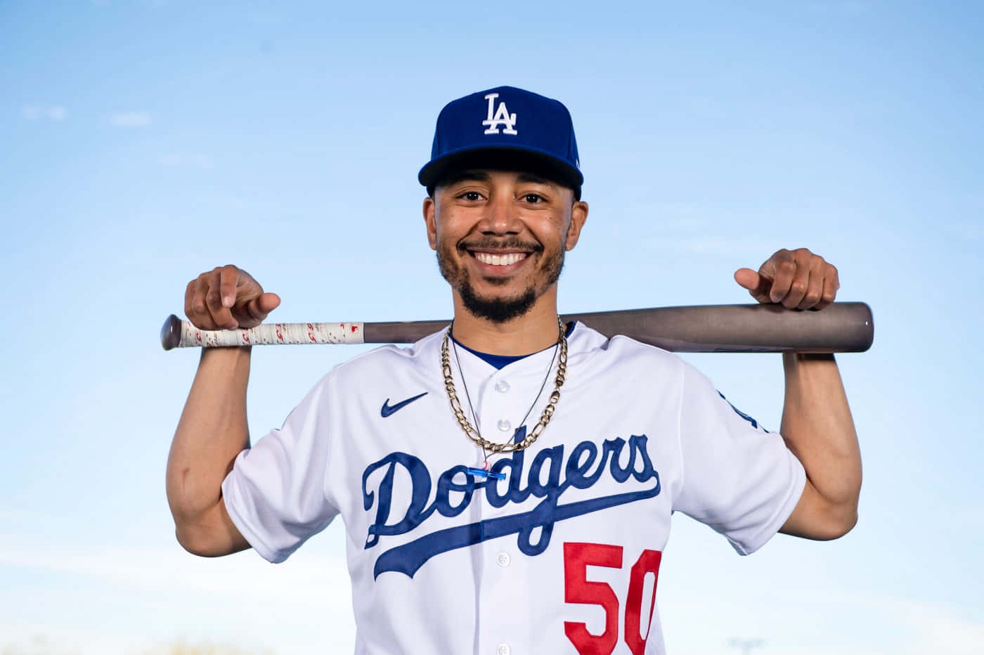 Smiling Dodgers Player With Bat Wallpaper