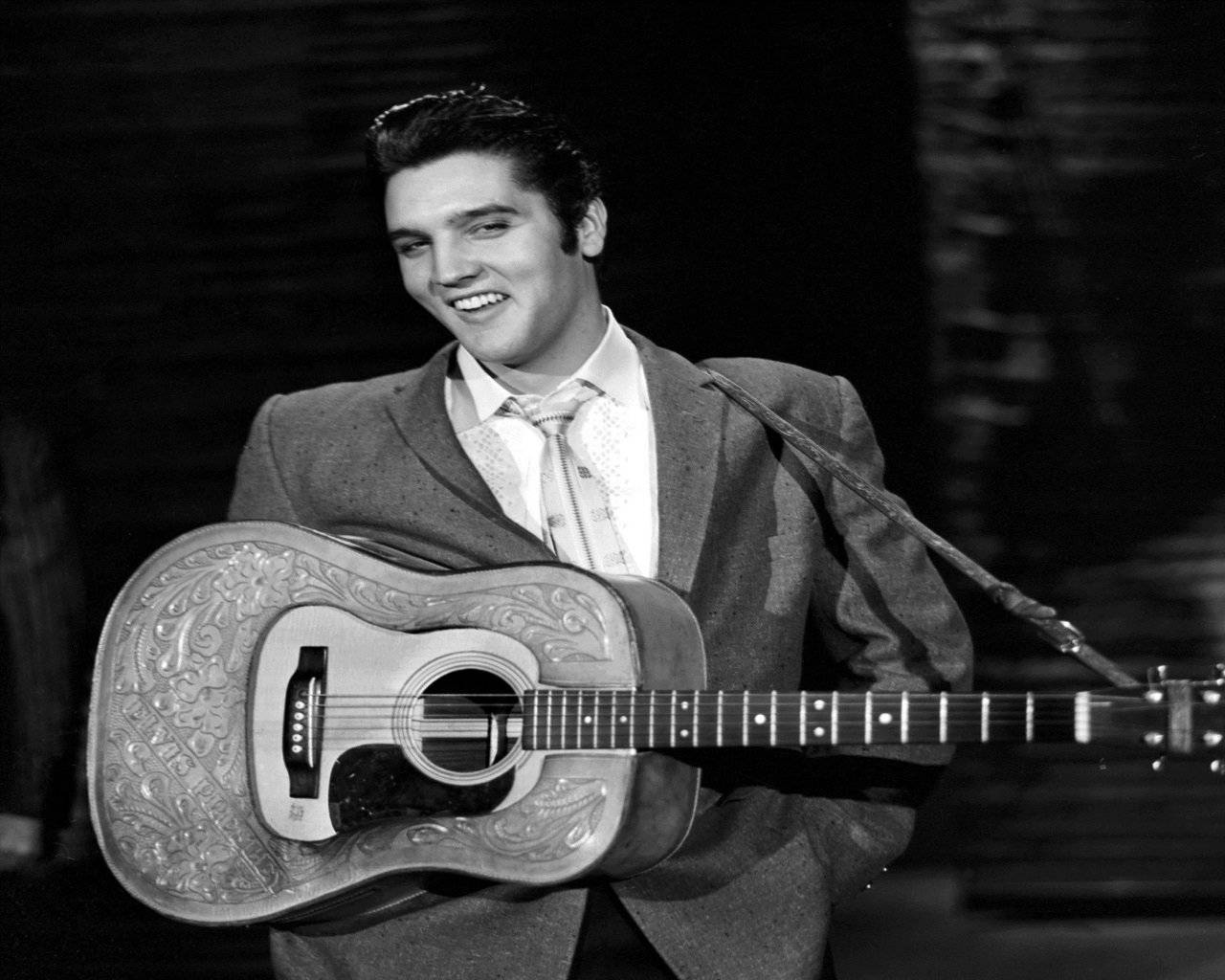Smiling Elvis Presley With Guitar Wallpaper