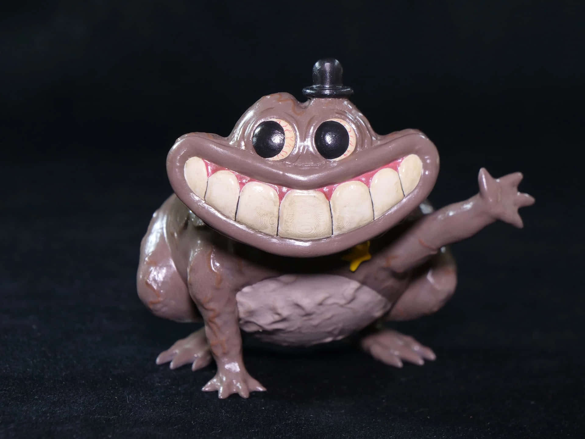 Smiling Frog Toy Figure Wallpaper