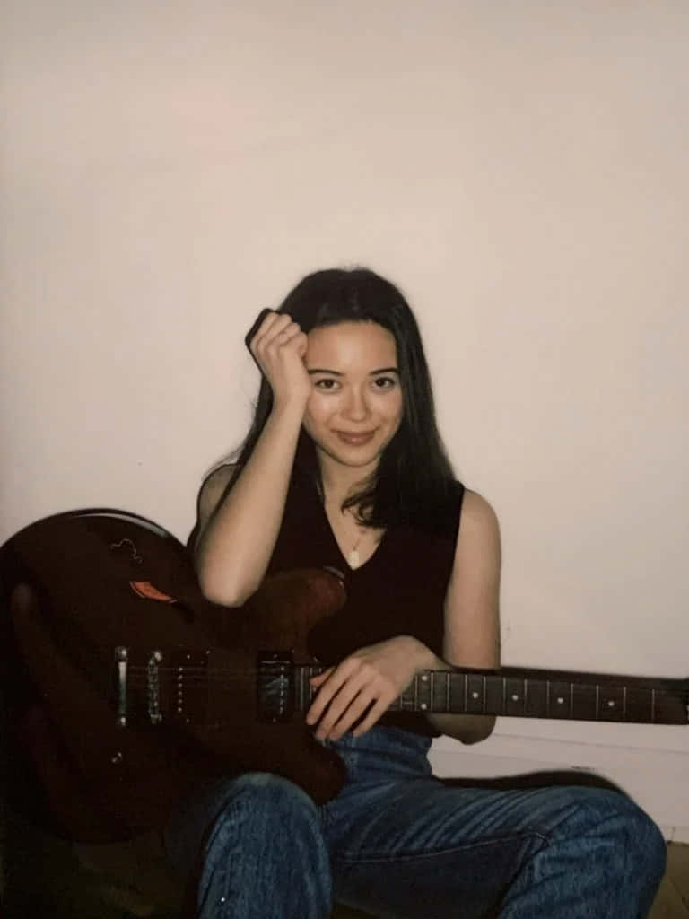 Smiling Guitarist Polaroid Wallpaper