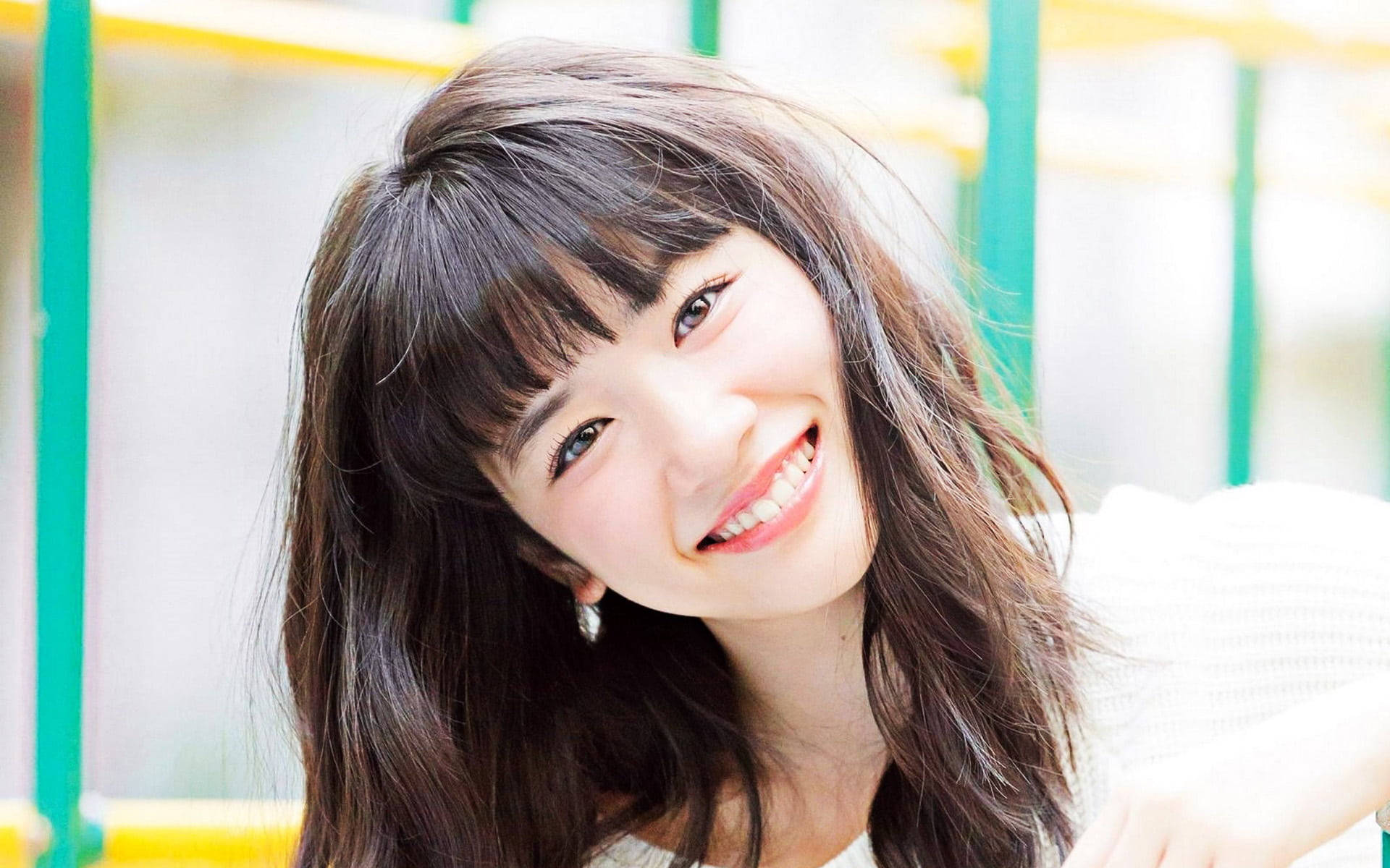 Smiling Japanese Girl With Messy Hair Wallpaper
