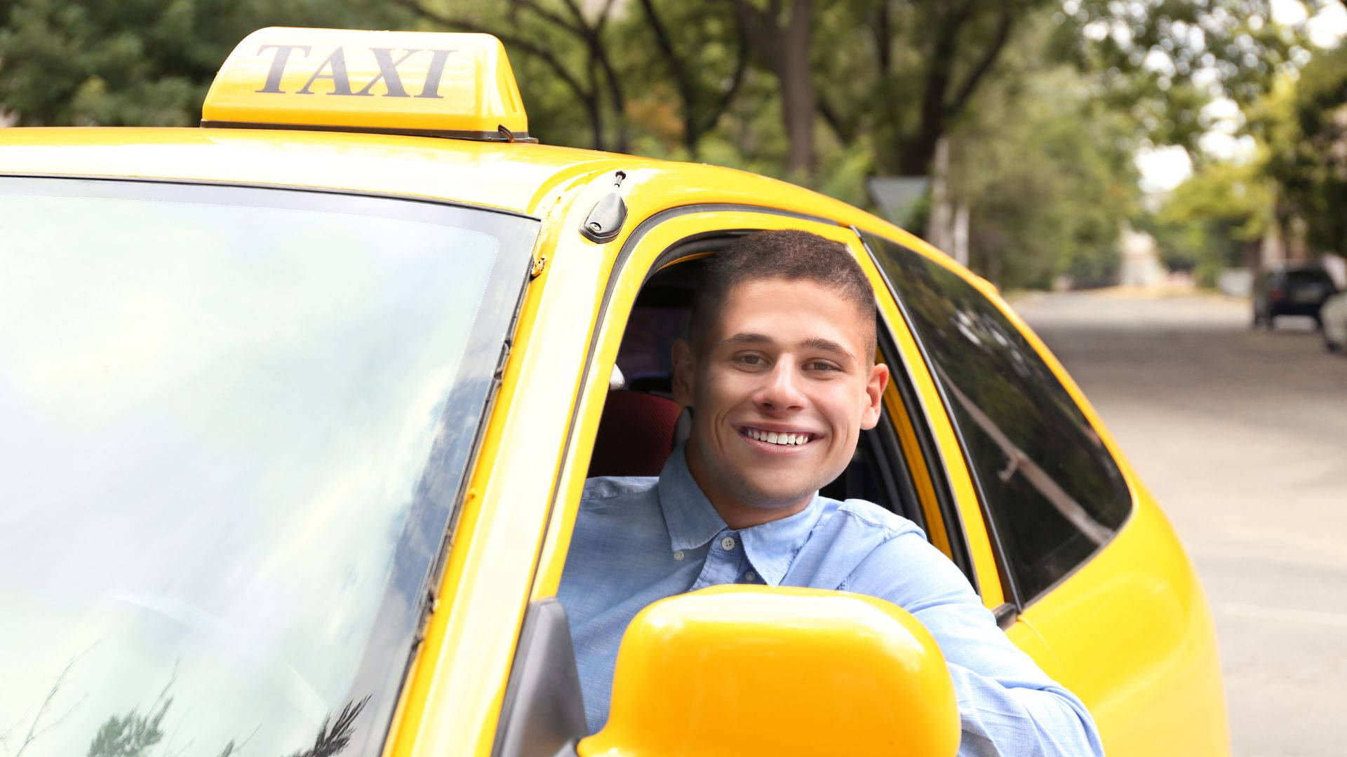 Download Smiling Male Taxi Driver Wallpaper 
