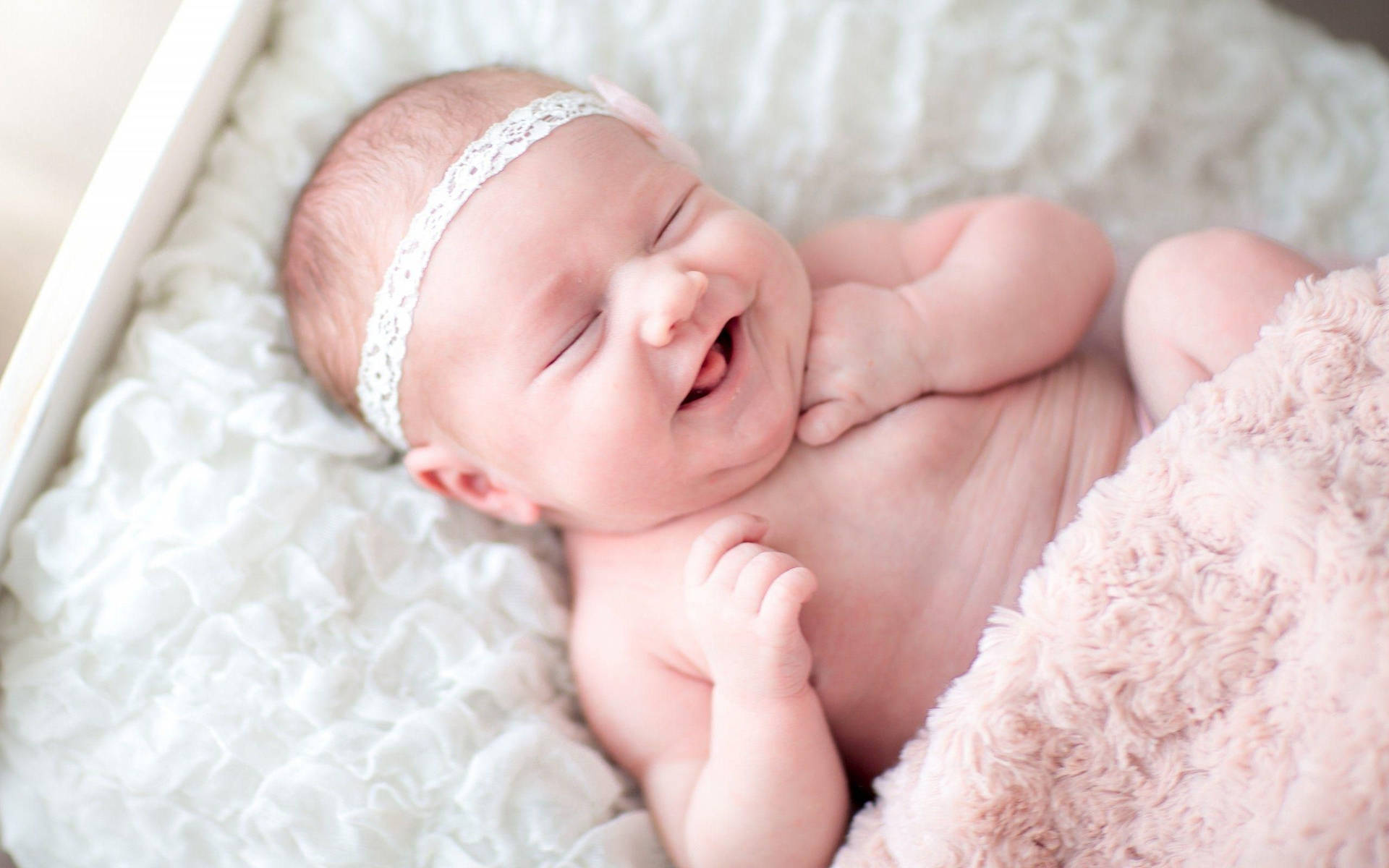 Download Smiling Newborn Baby Wallpaper 