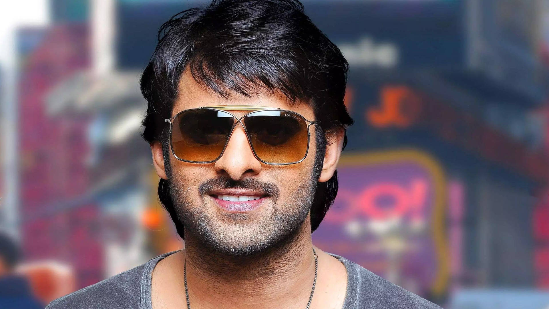 Smiling Prabhas Hd With Colorful Background Wallpaper