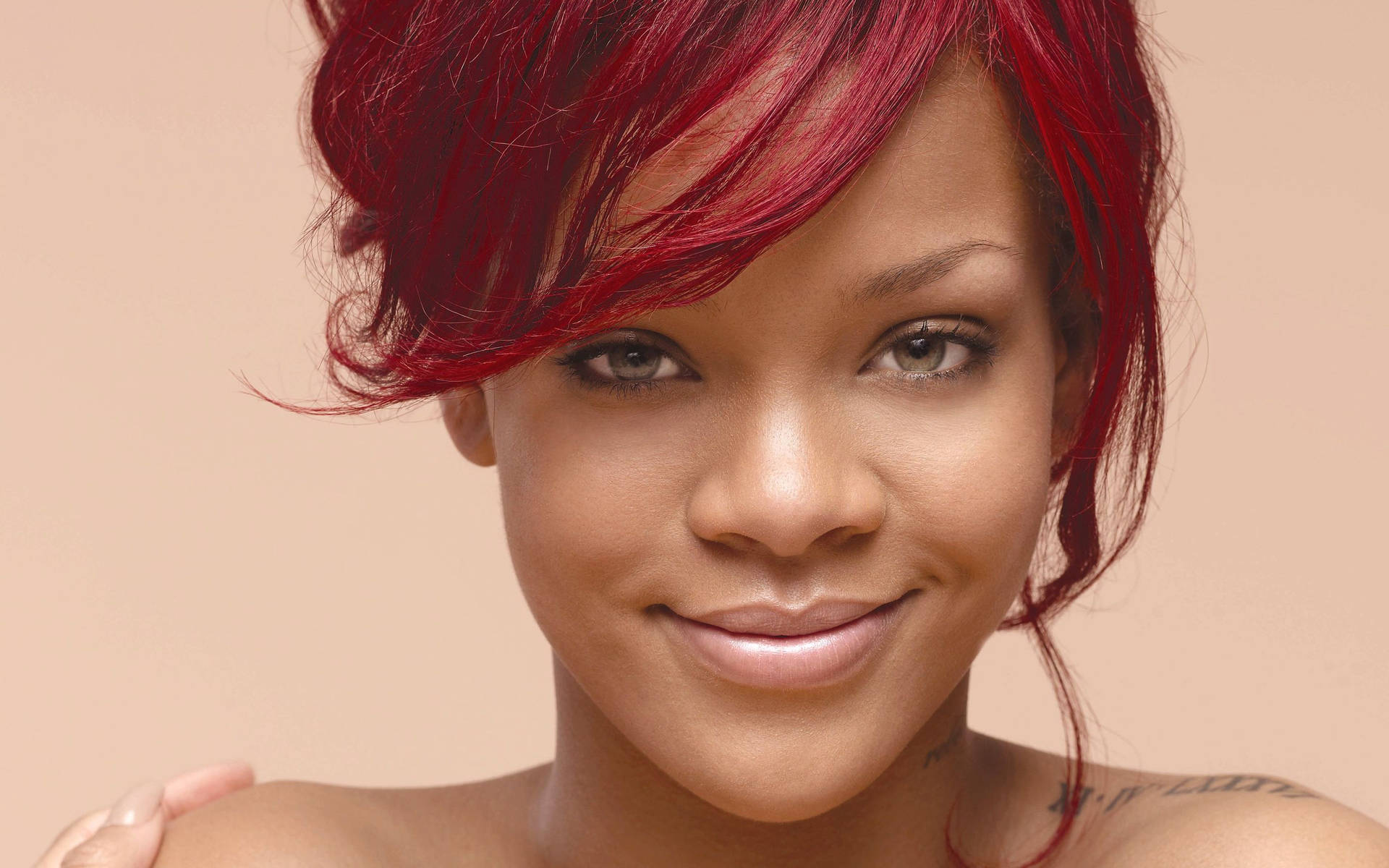 Smiling Rihanna In Bare Skin Background
