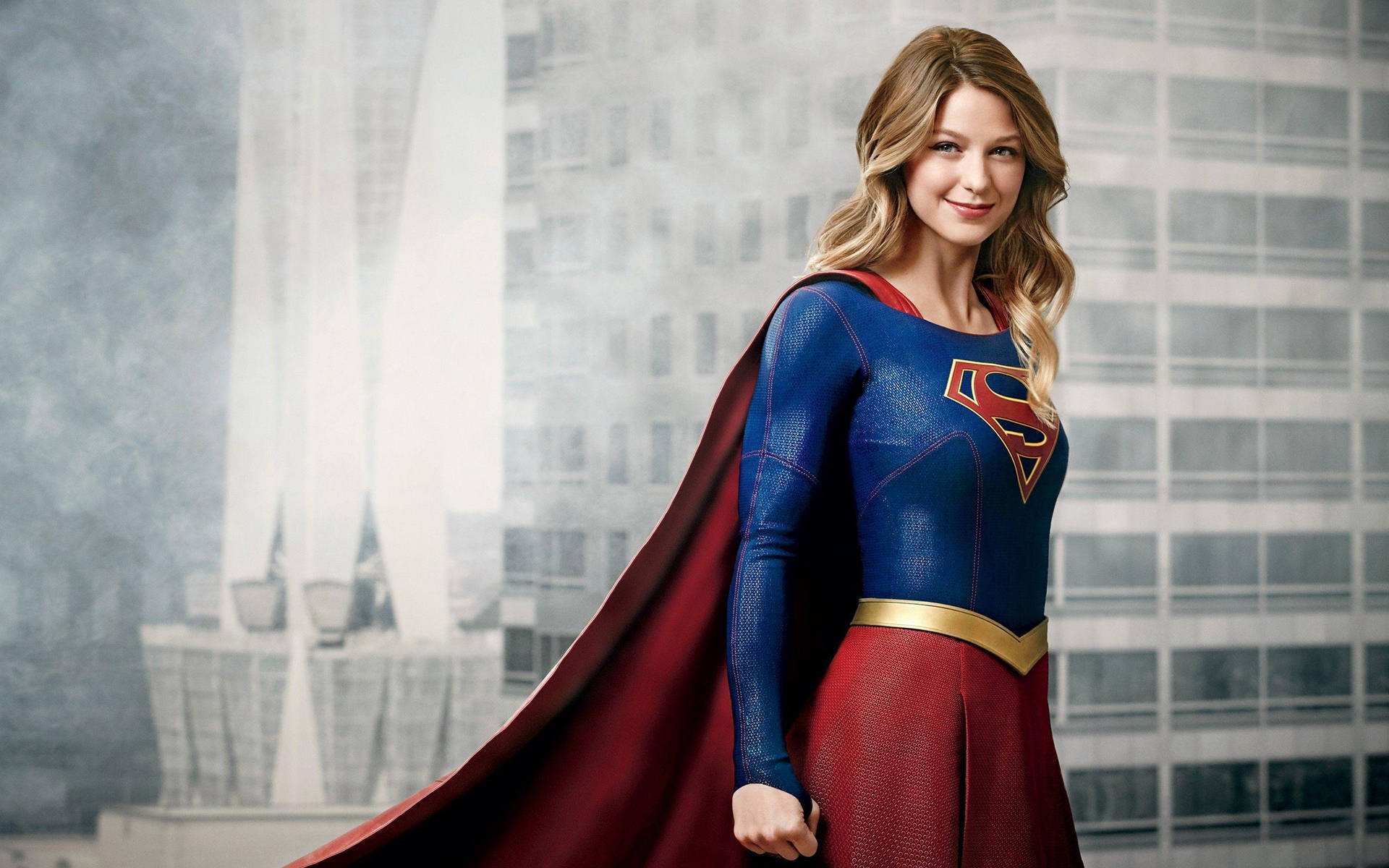 Smiling Supergirl In Building Background