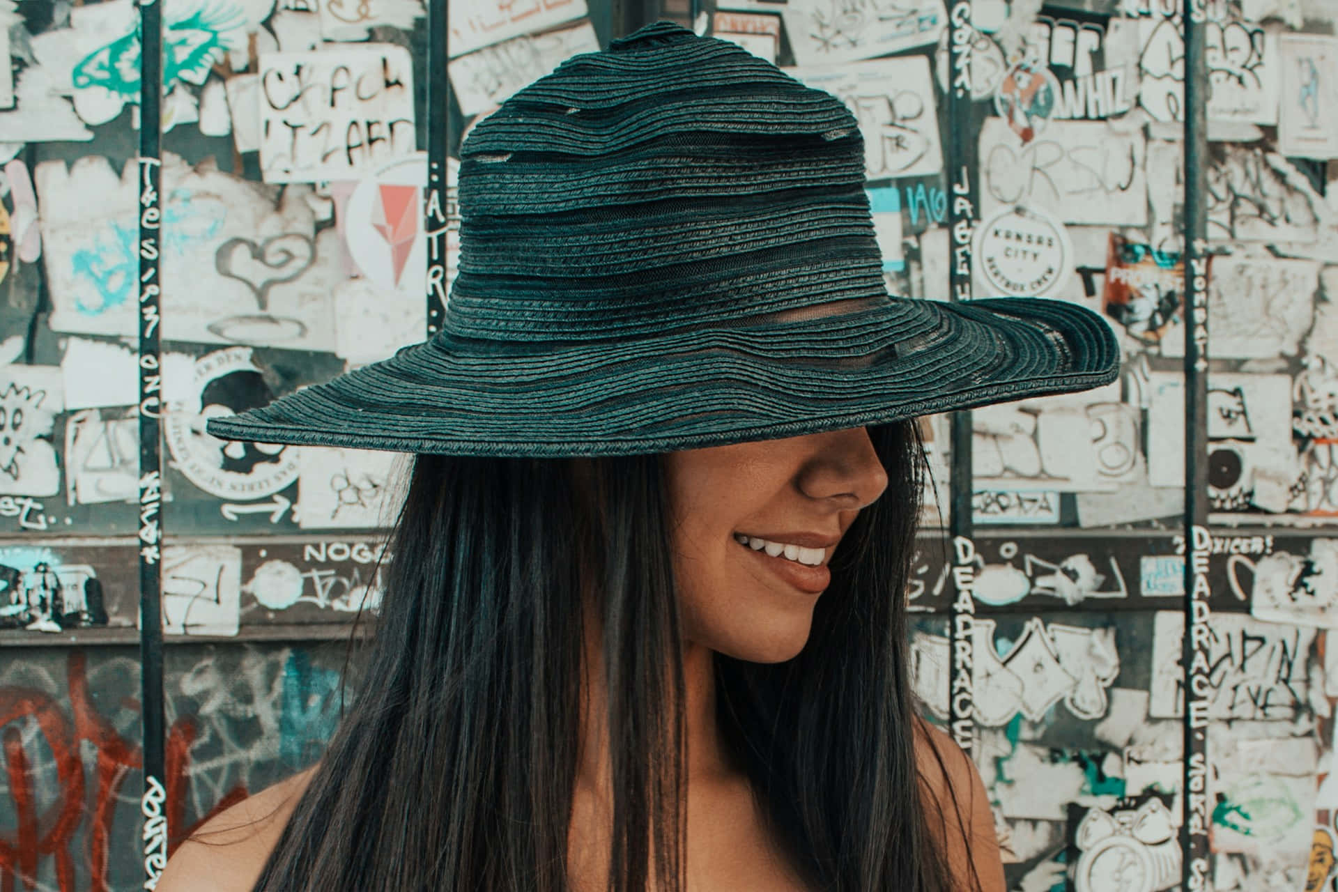 Smiling Woman Oversized Hat Wallpaper