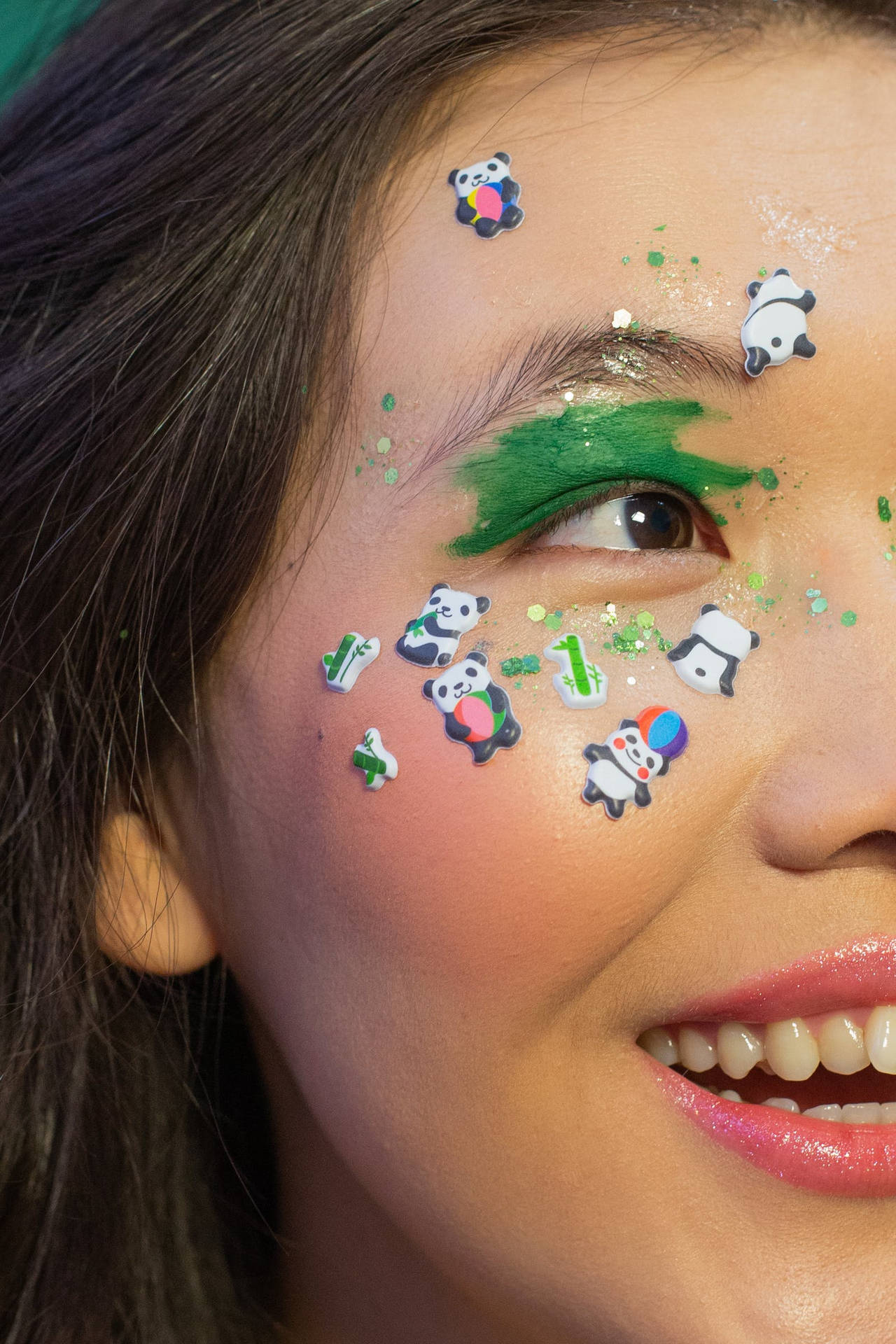 Smiling Woman With Beautiful Panda Makeup Wallpaper