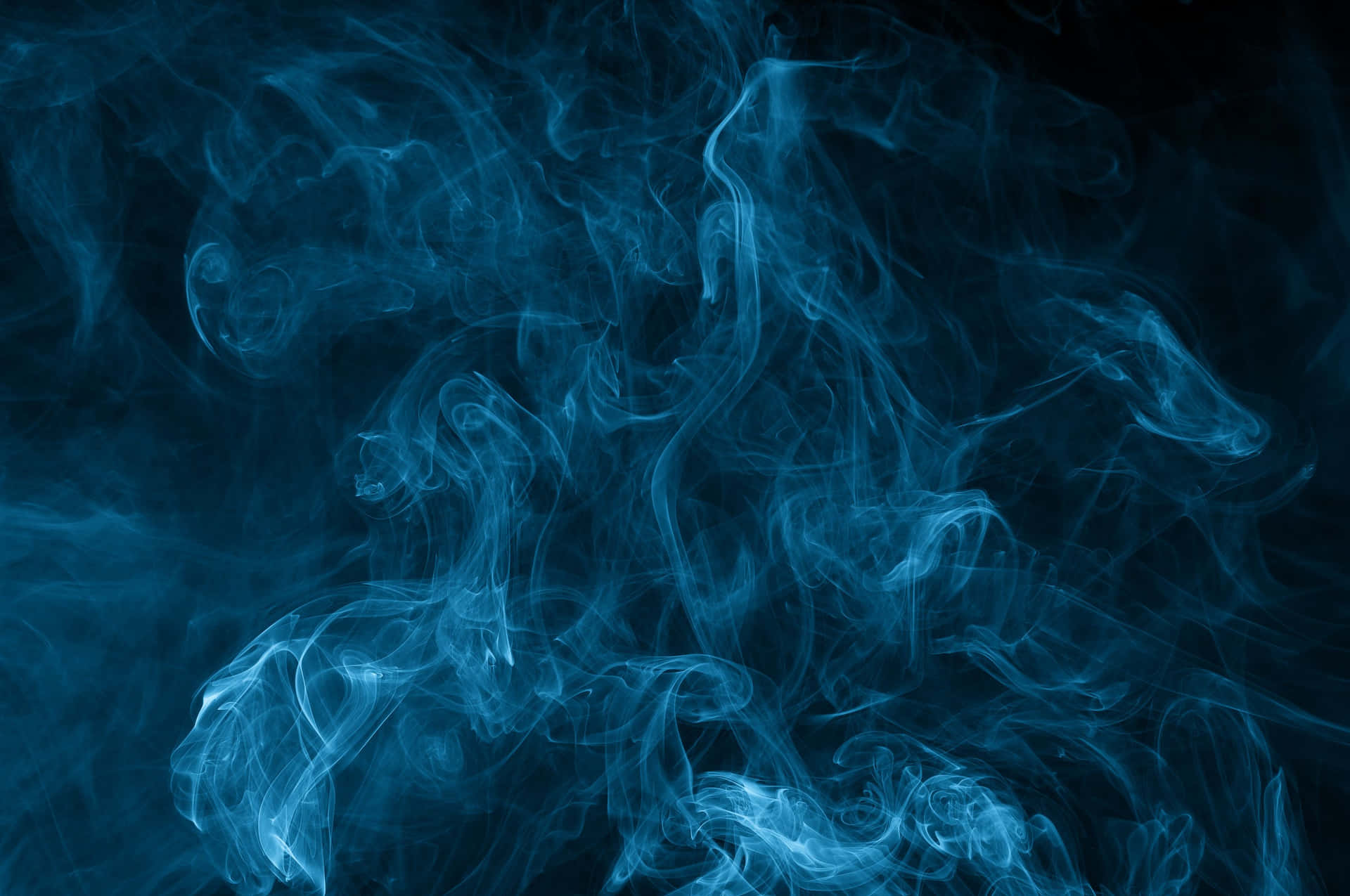 Light Blue Smoke In Black Background