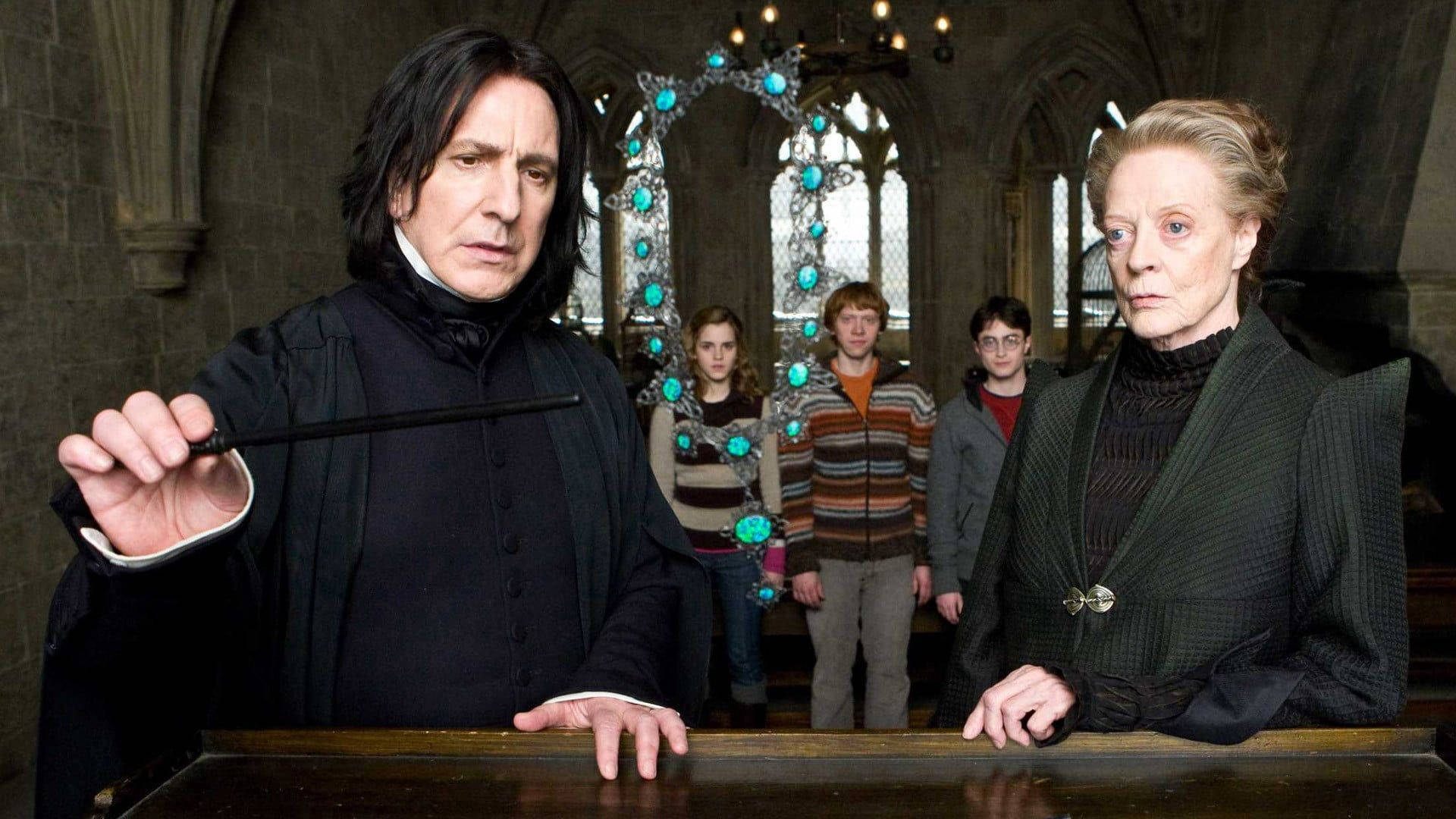 Ron Weasley, Professor McGonagall and Professor Snape stand together at Hogwarts. Wallpaper