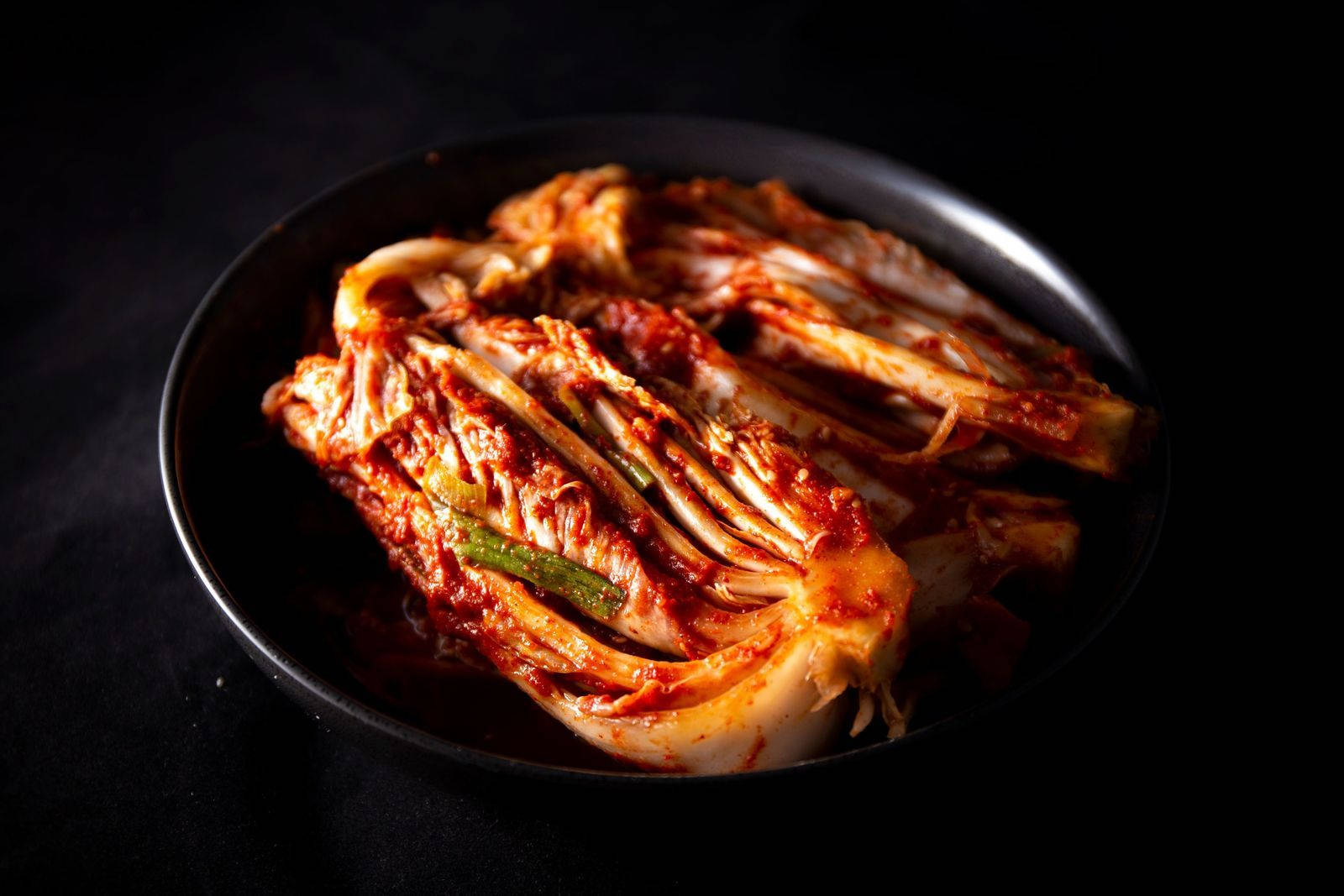 Snapshot Of Kimchi On Black Plate Wallpaper