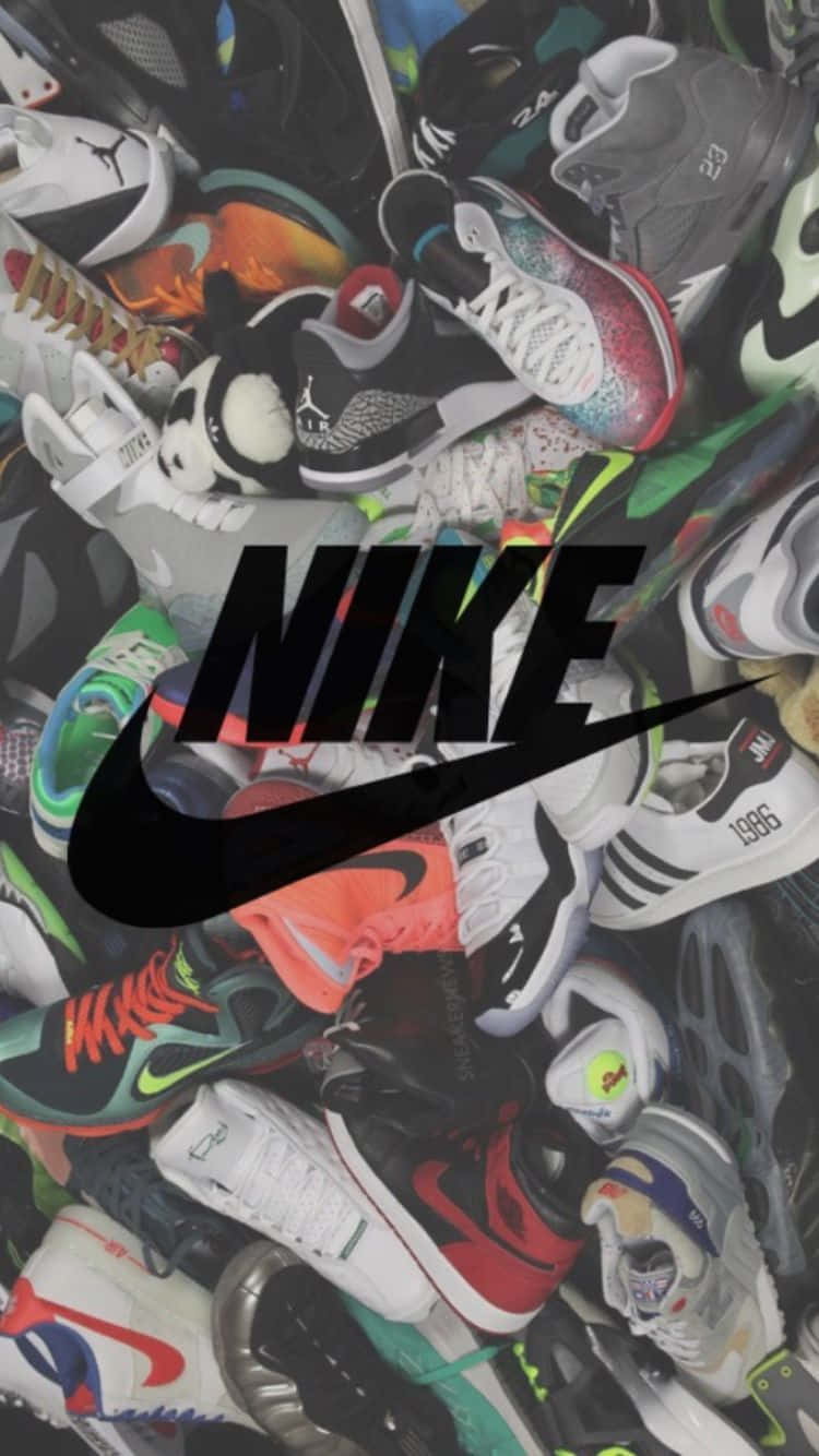 Nike Shoes Are Piled Up In A Pile Wallpaper