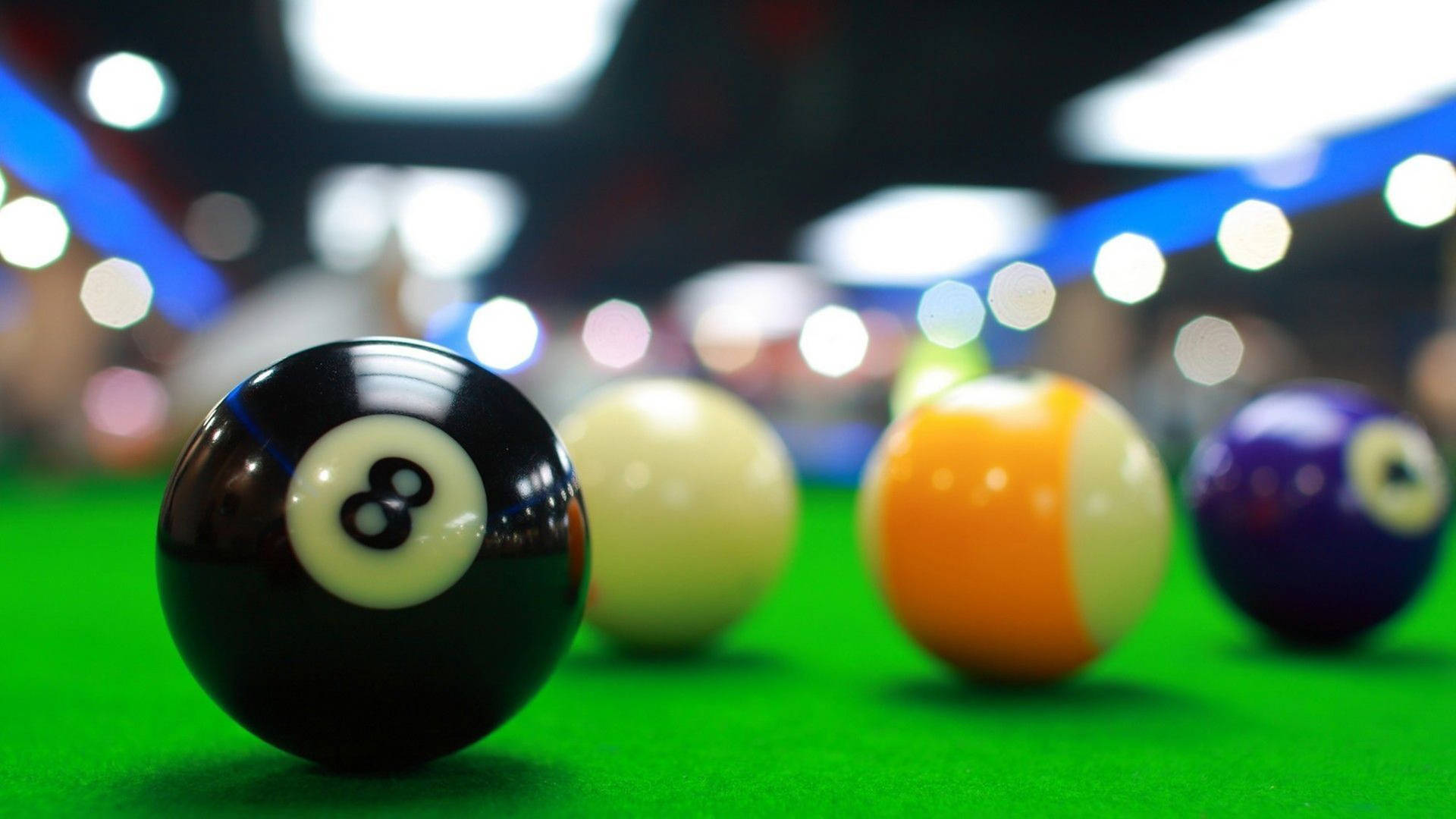 Caption: Competitive Snooker Play - Detailed Shot of Balls Positioned on Green Table Wallpaper