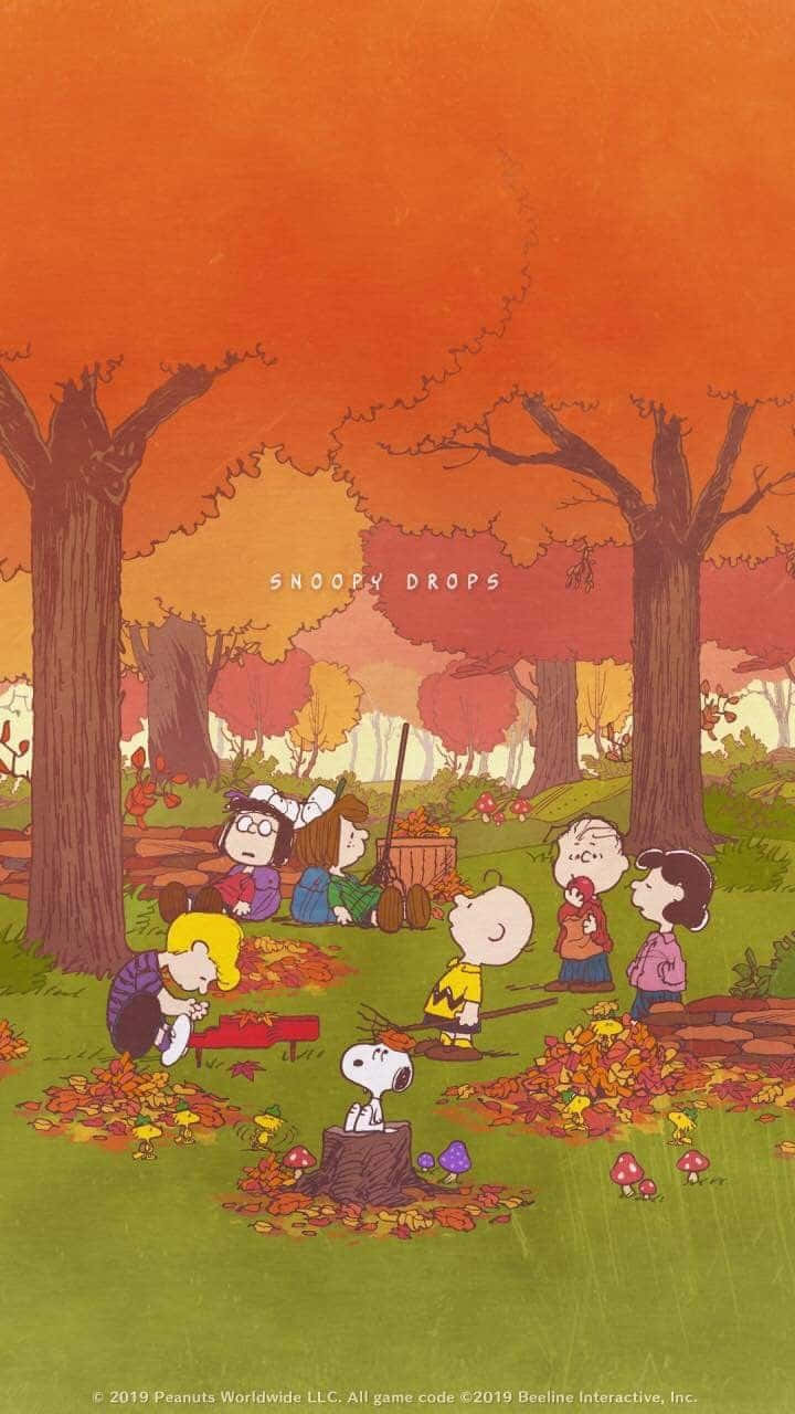 Snoopy basking in the beauty of Autumn Wallpaper