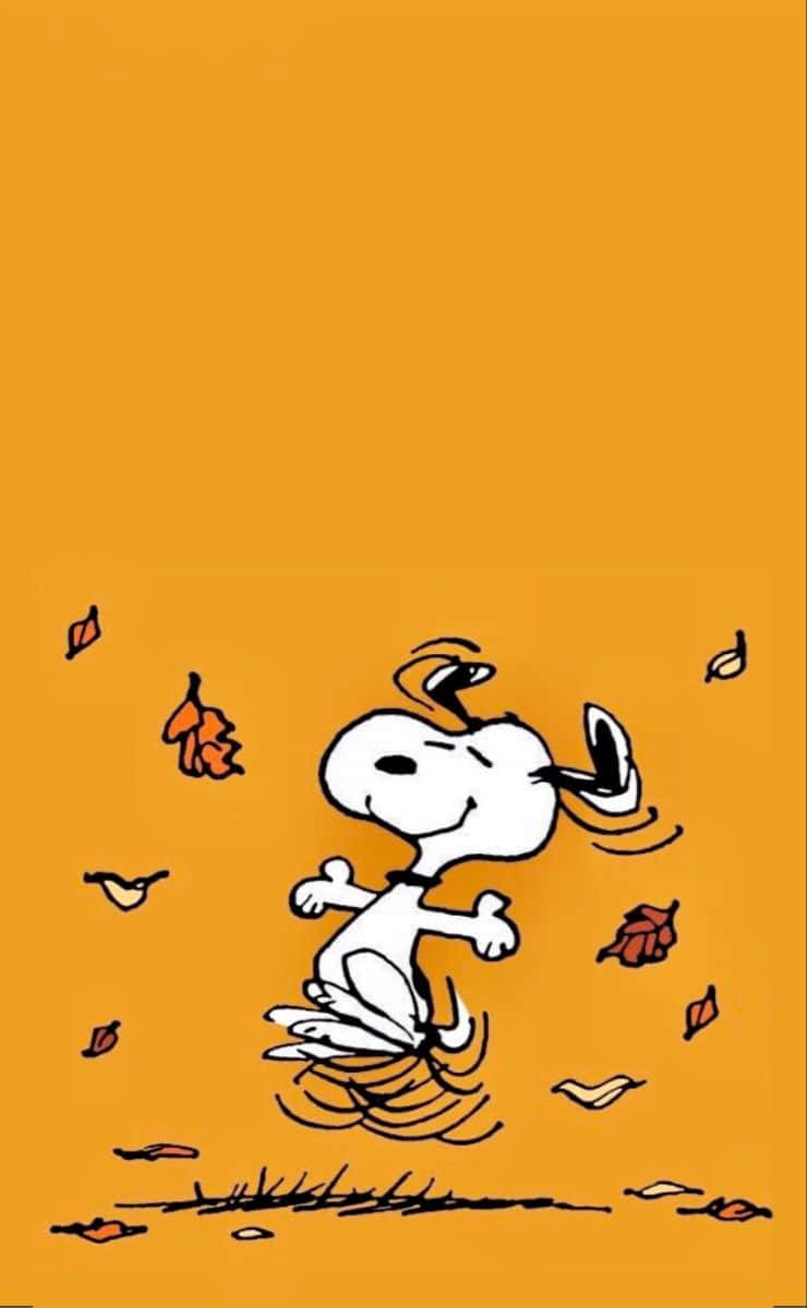 Snoopy celebrates autumn in all its glory Wallpaper