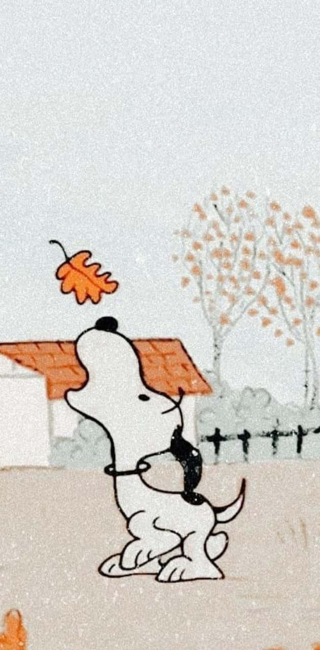 Snoopyfirar Hösten Med En Glad Dans På Dator- Eller Mobilskärmen. Wallpaper