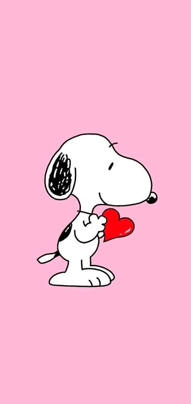 Snoopy Holding Heart Pink Background Wallpaper