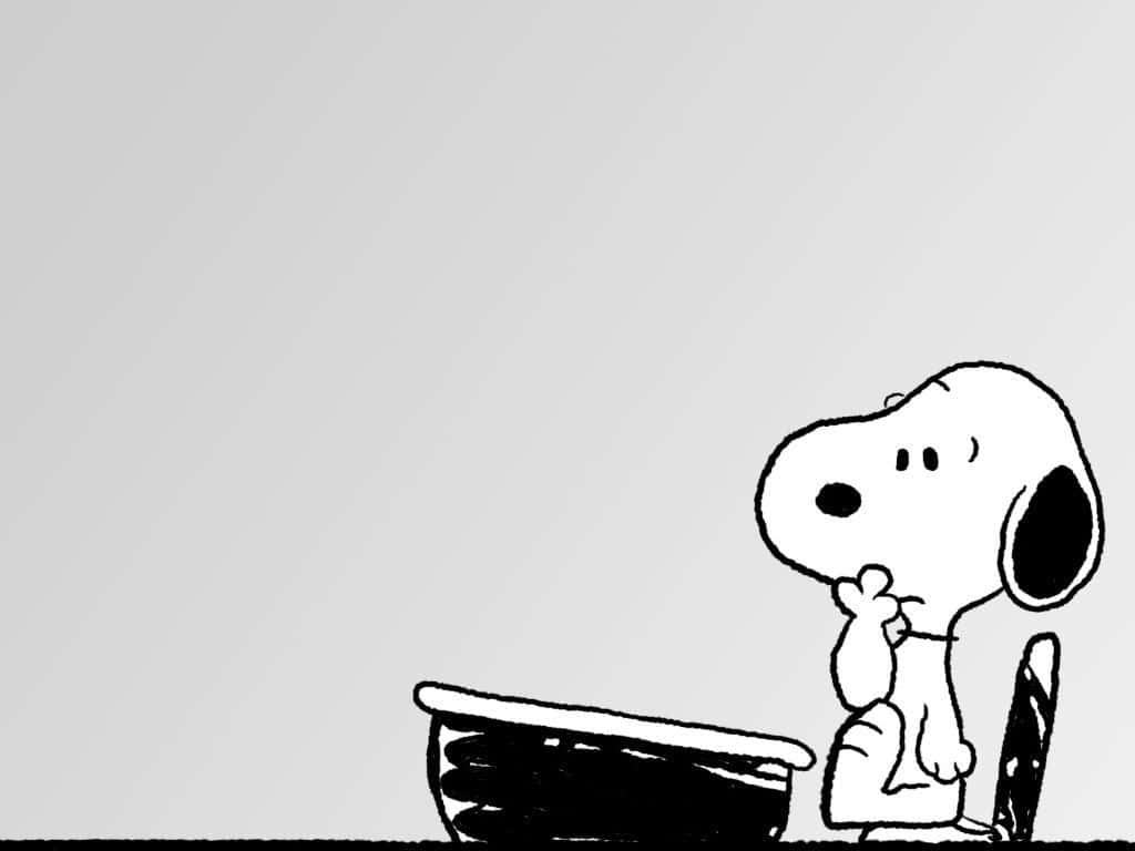Snoopy Thinkingat Desk Wallpaper