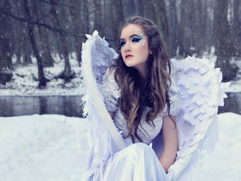 Person Making a Beautiful Snow Angel Wallpaper