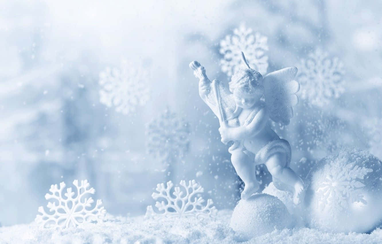 A joyful child creating a beautiful snow angel. Wallpaper