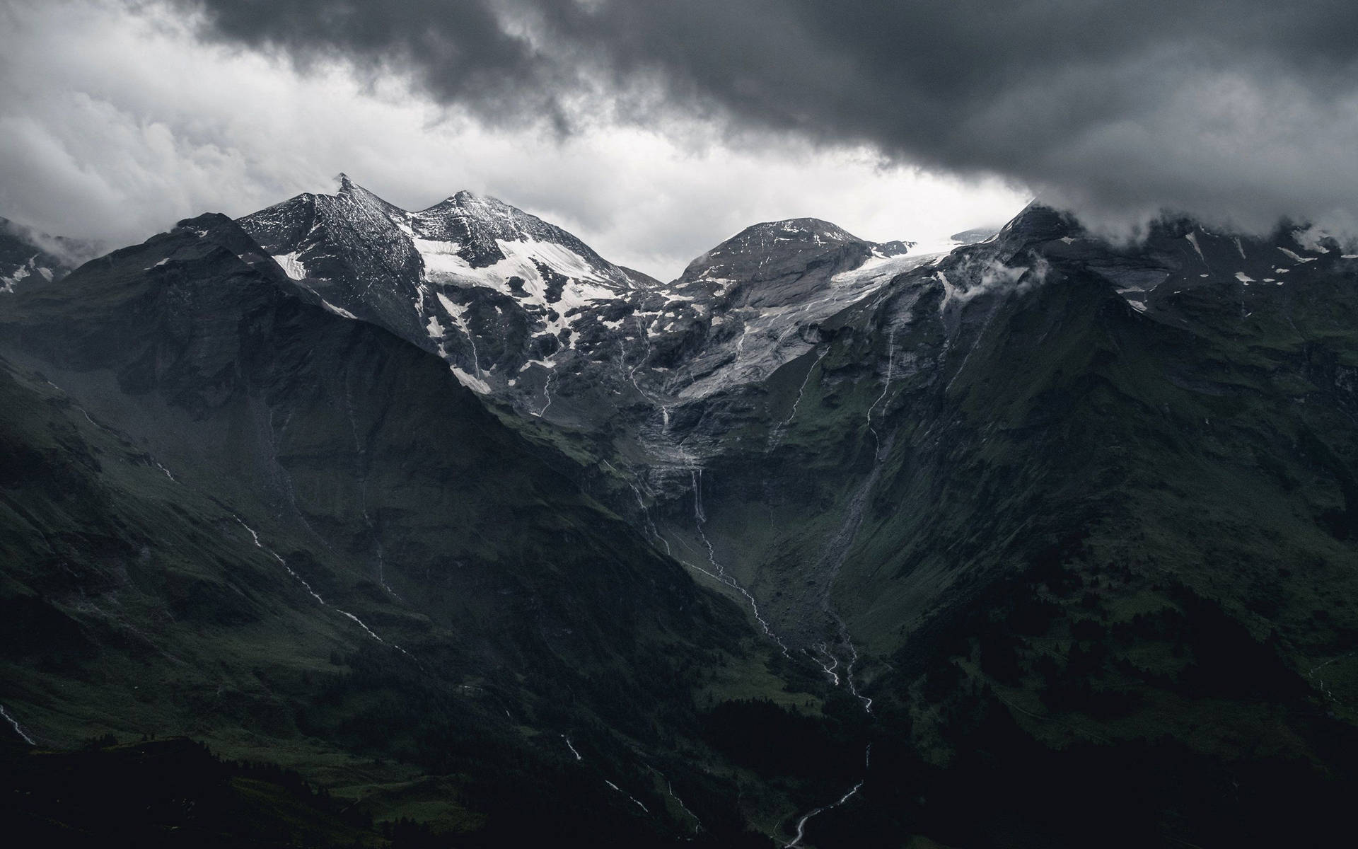 Brave the Elements with this Snow-Capped Mountain Wallpaper