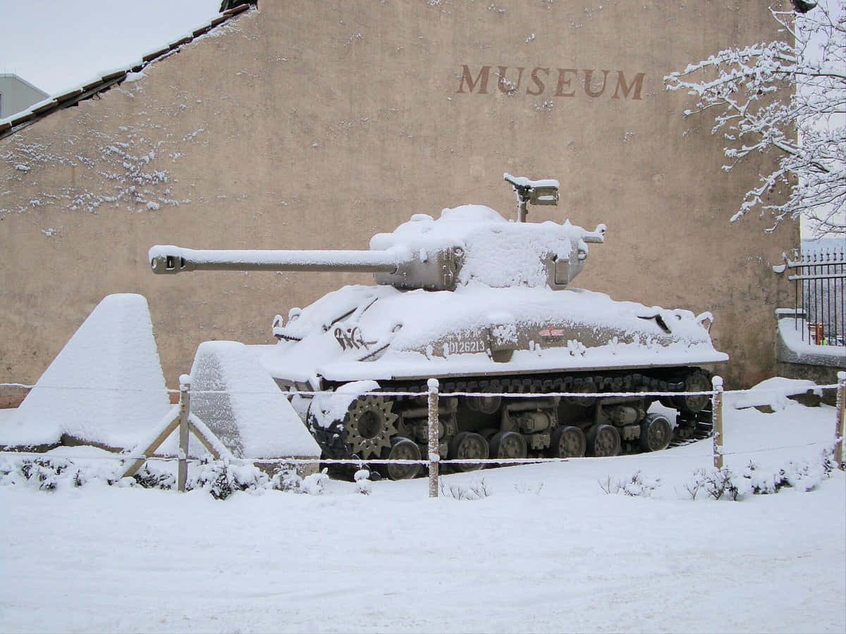 Snow Covered Tankat Diekirch Museum Wallpaper