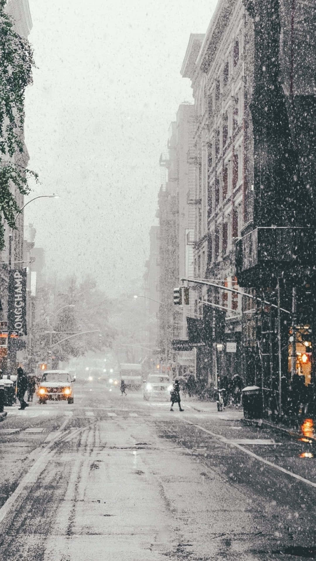 City Street With Snow Falling Wallpaper