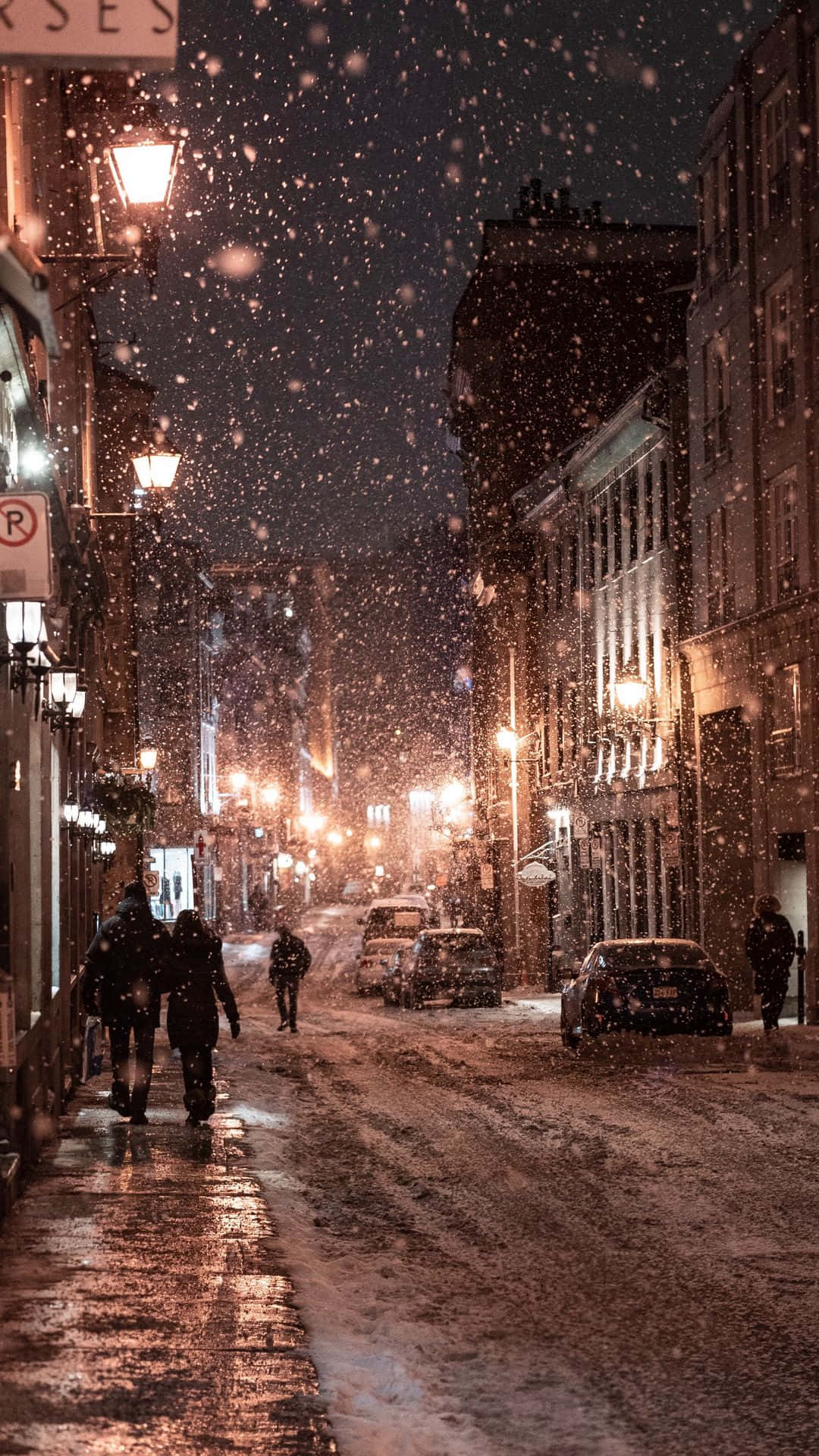 People Walking With Snow Falling Wallpaper