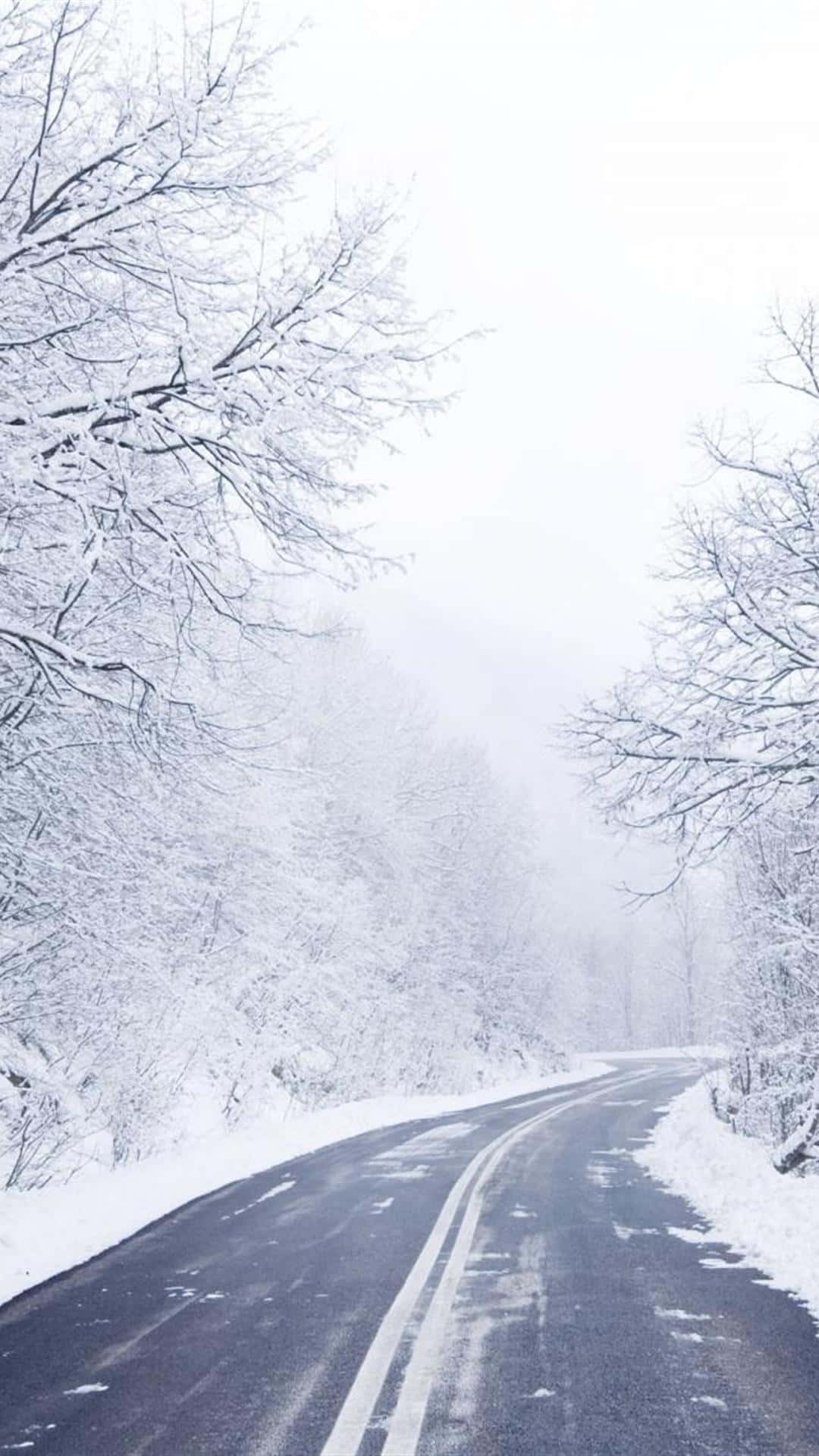 Empty Road In Snow iPhone Wallpaper