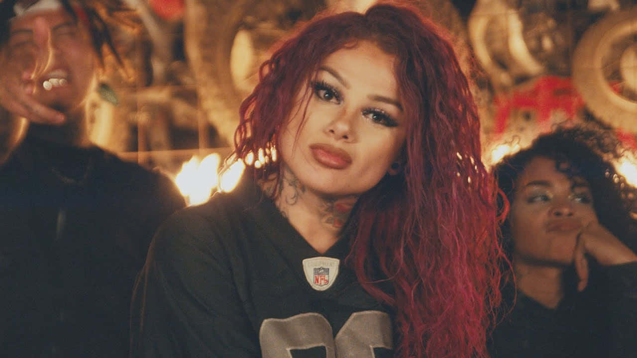 Download Snow Tha Product Red Hair Fire Backdrop Wallpaper | Wallpapers.com