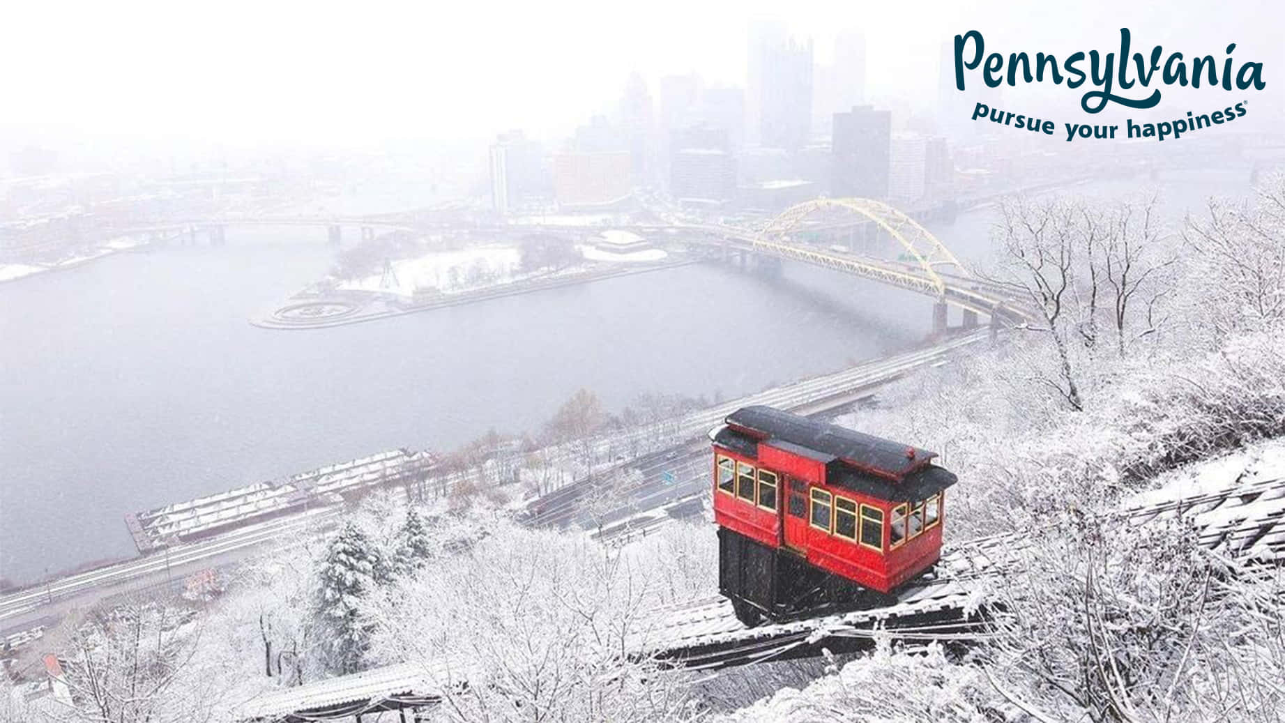 A Red Trolley Car Is On A Snow Covered Hill