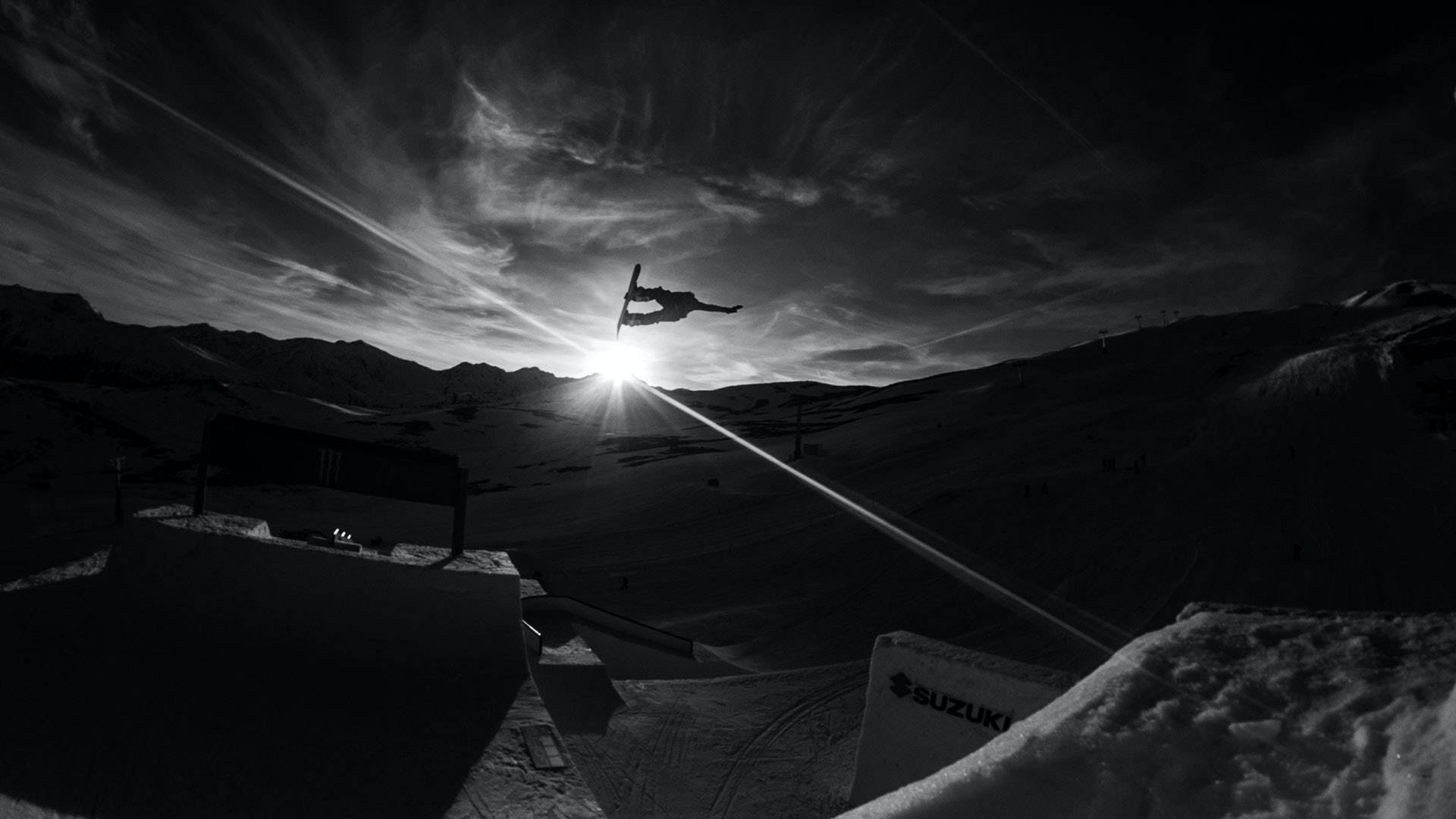 Snowboardenbeim Sonnenaufgang Wallpaper