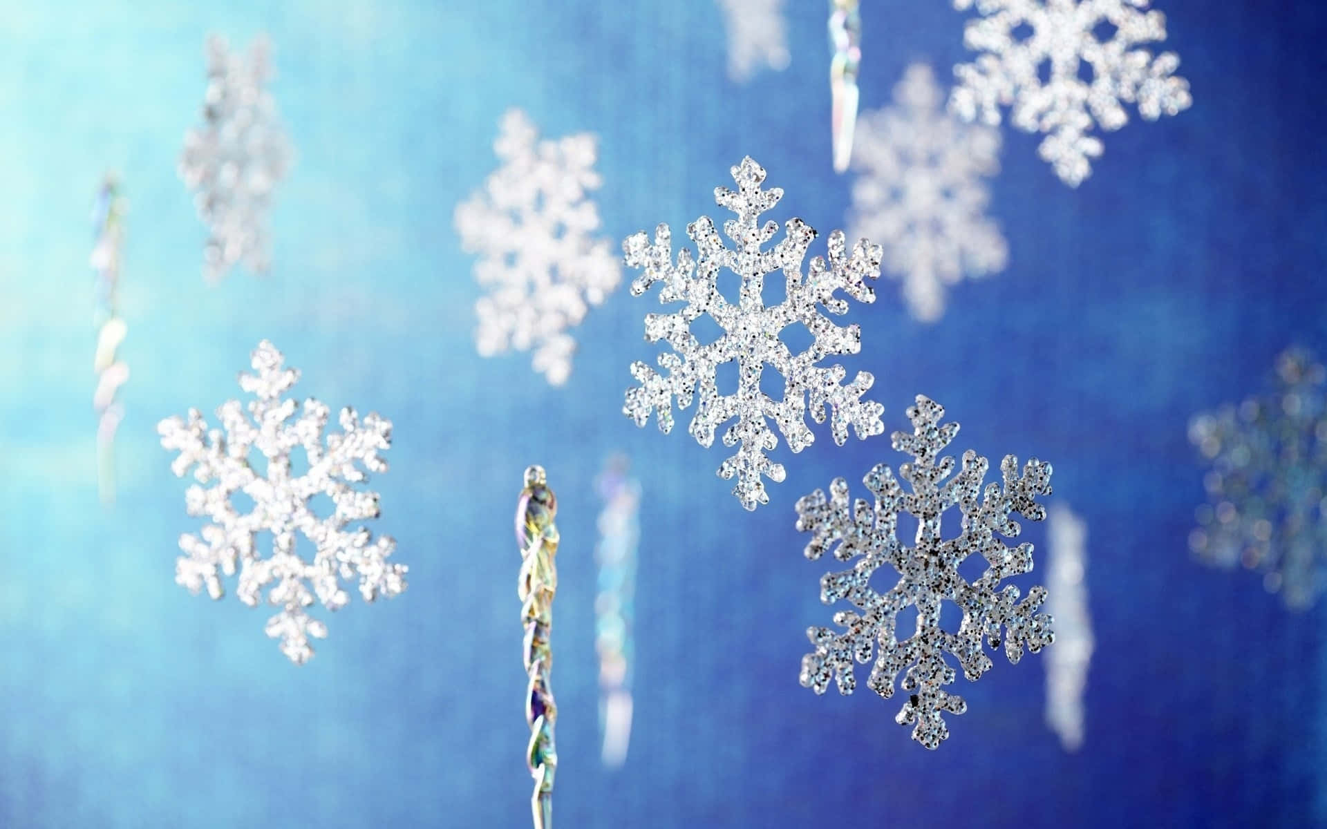 A crystalline snowflake against an icy blue backdrop