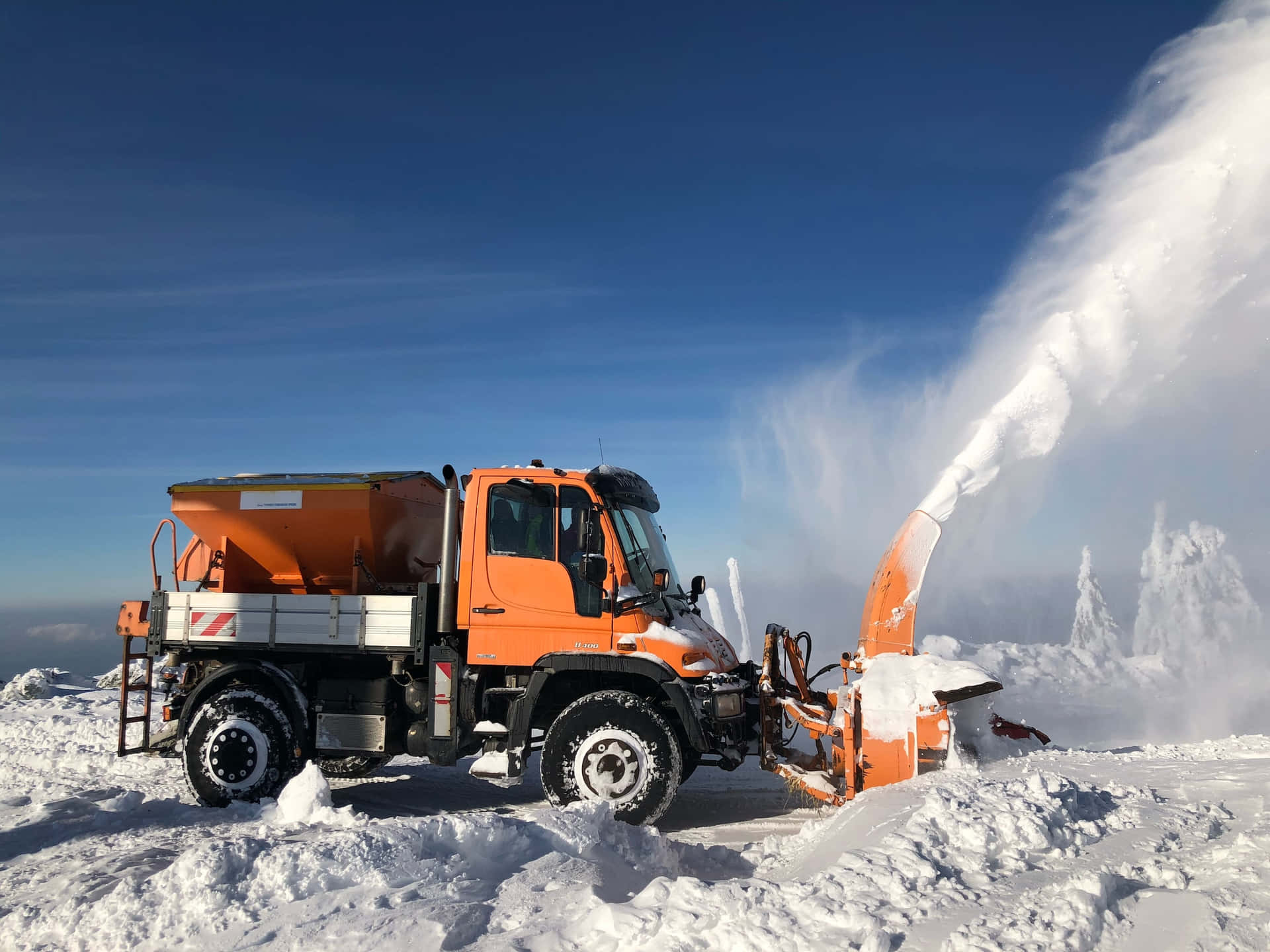 Caption: Powerful Snowplow Clears Winter Road Wallpaper