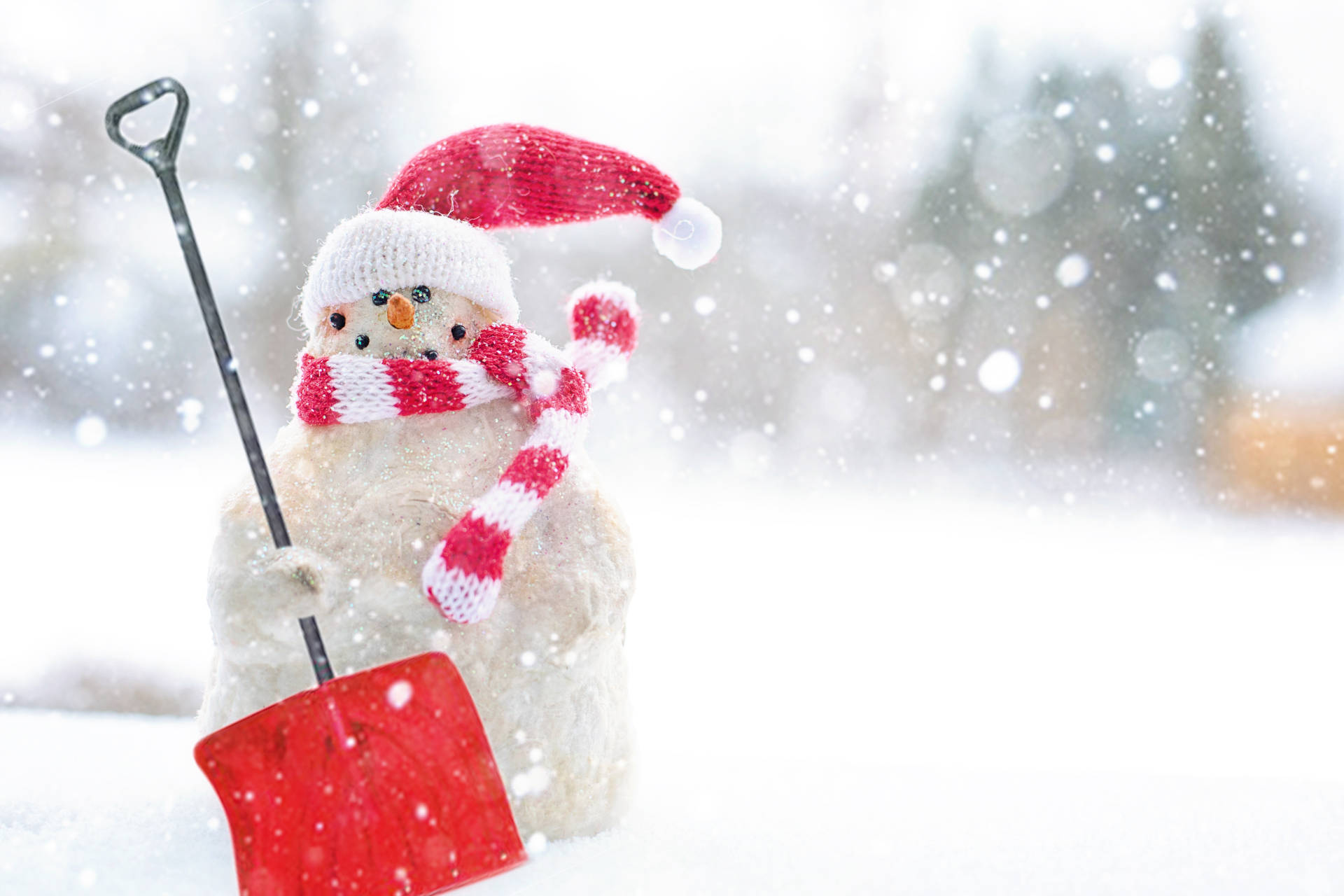 A Snowman With A Shovel In The Snow Wallpaper