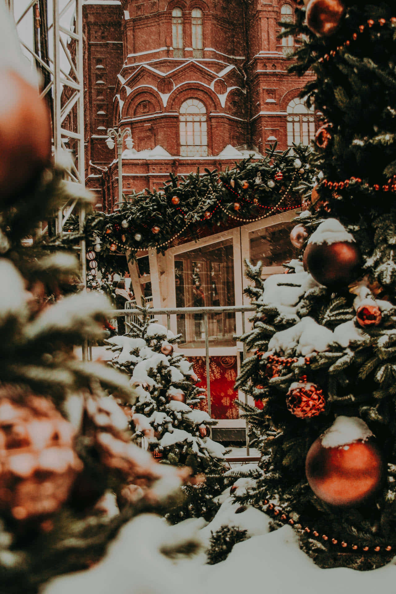 Snowy_ Christmas_ Market_ Near_ Historic_ Building.jpg Wallpaper