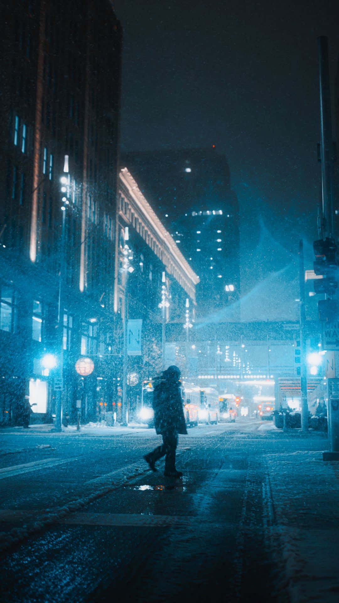 Snowy_ City_ Night_with_ Pedestrian.jpg Wallpaper