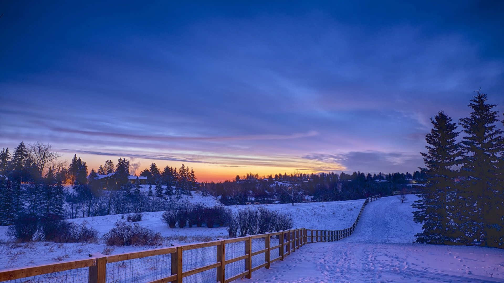 Serene Snowy Landscape at Sunrise Wallpaper
