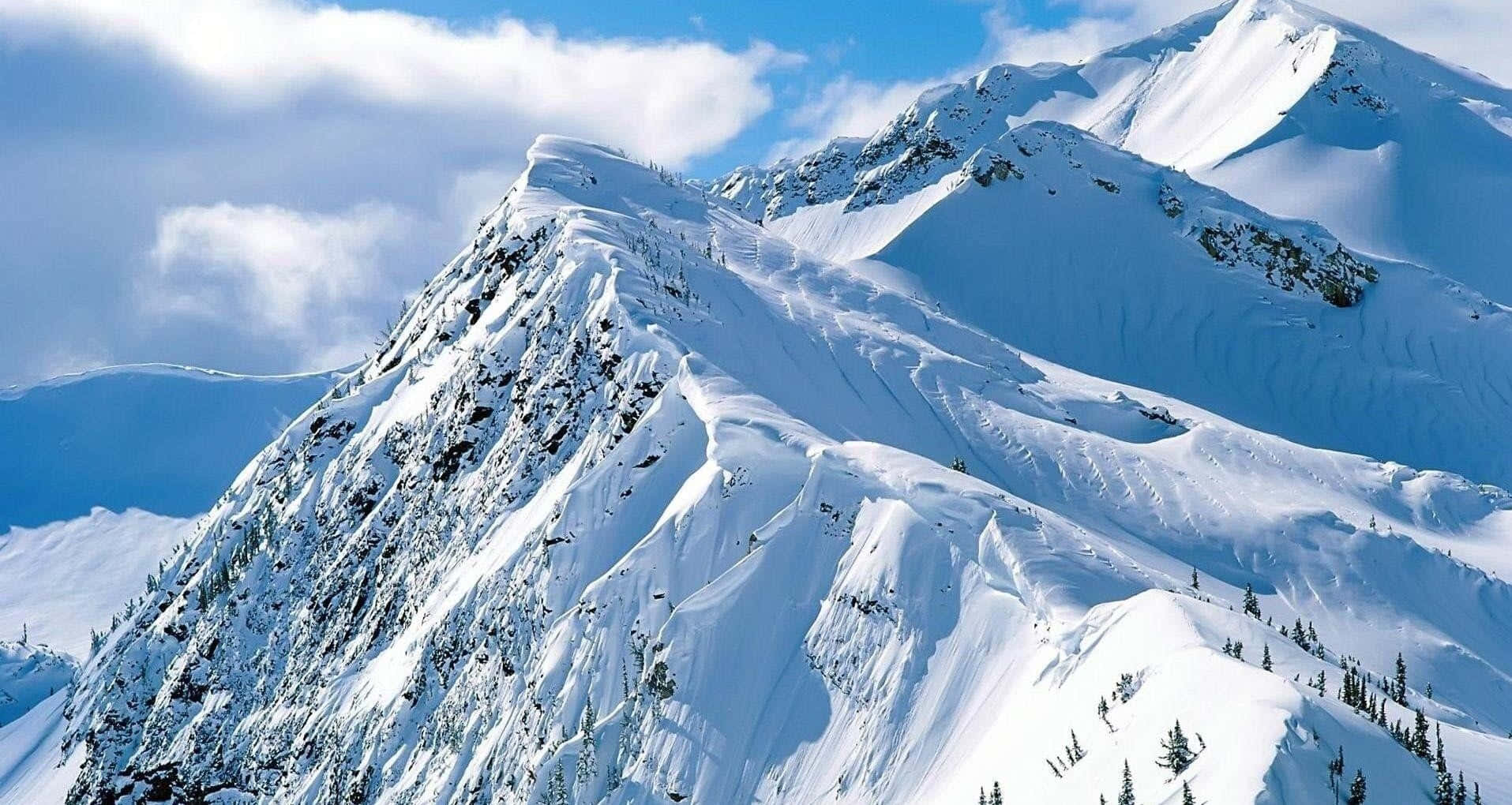 A Majestic View Of Snowy Mountain Peaks