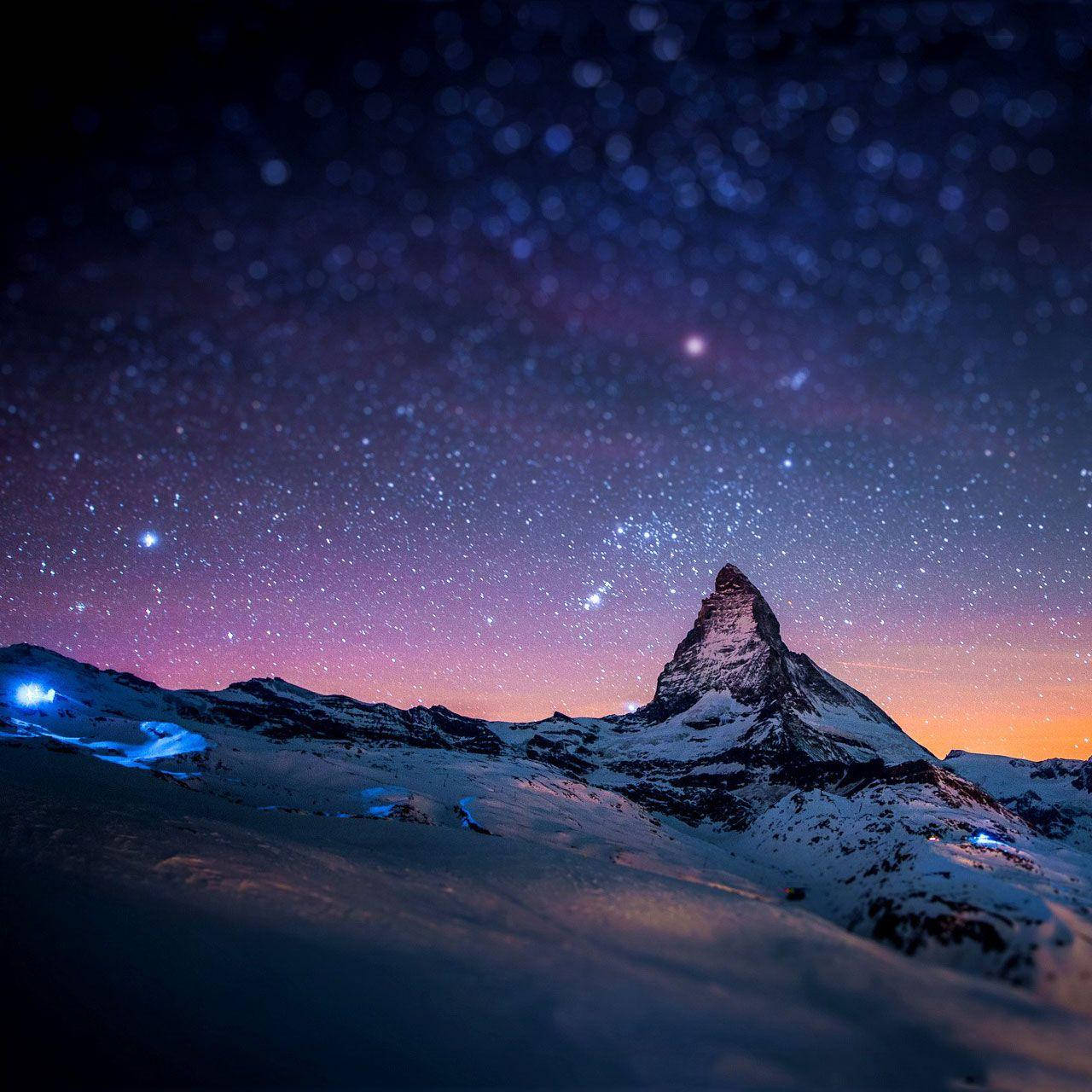 Stellar View: Snowy Mountain Displayed on Galaxy Tablet Wallpaper