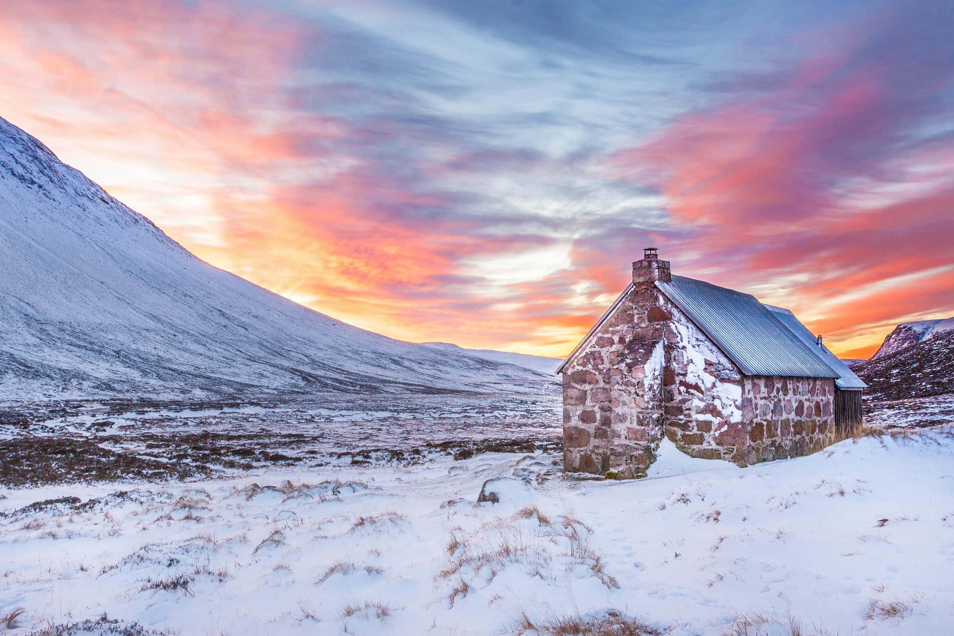 Snowy_ Sunset_ Over_ Mountain_ Cottage Wallpaper