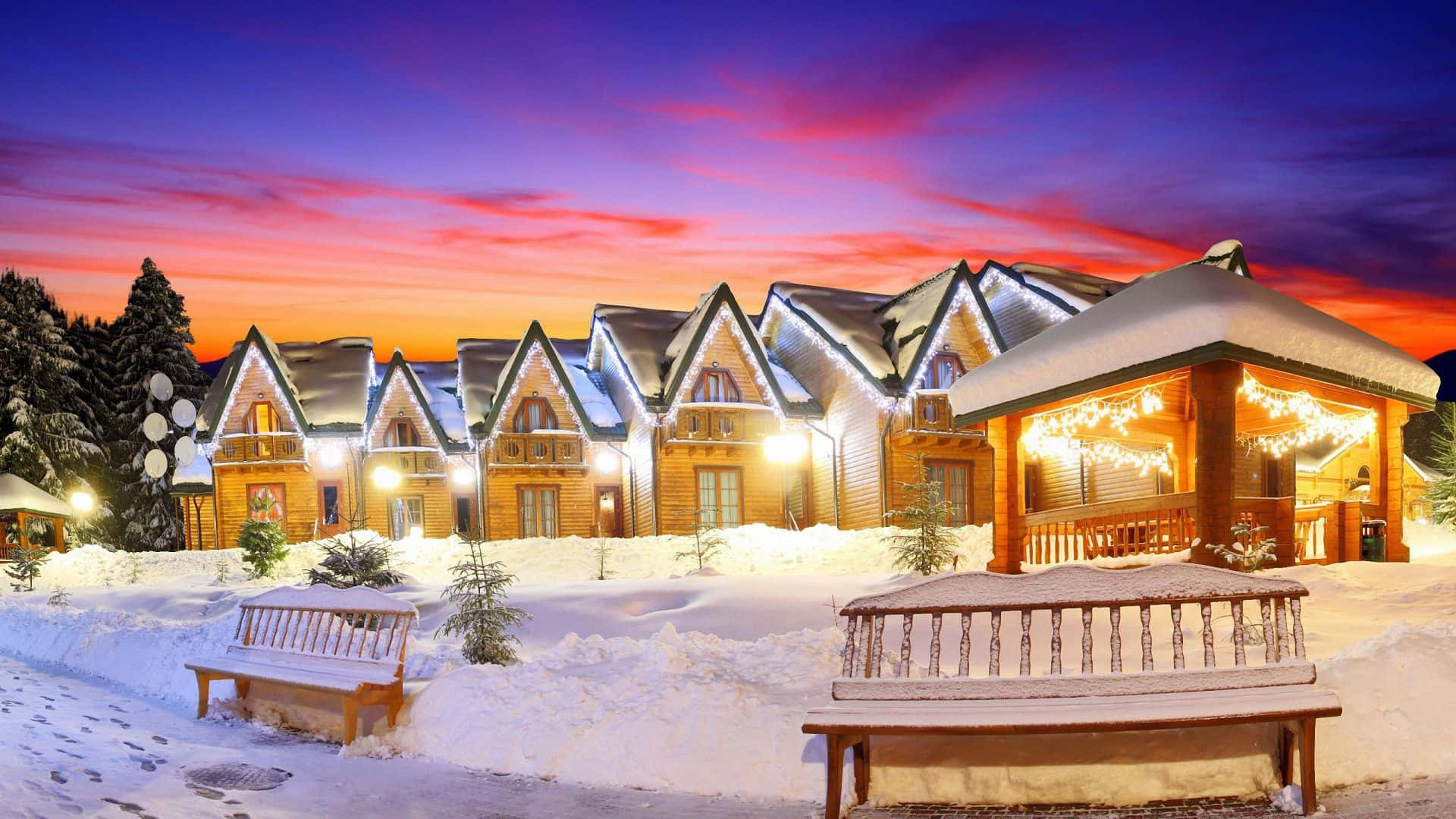 Picturesque Snowy Village Scene Wallpaper