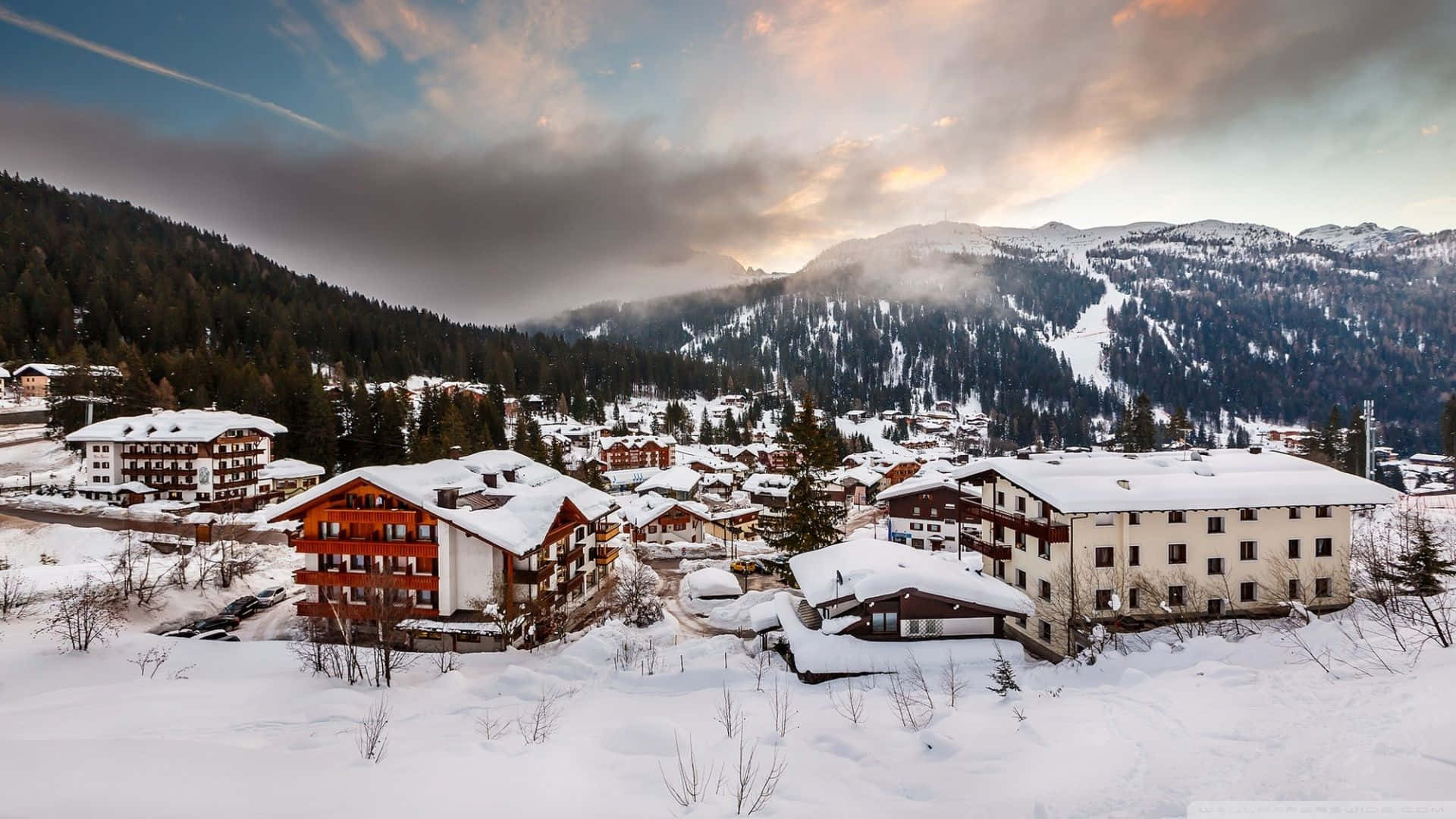 Enchanting Snowy Village during Winter Season Wallpaper